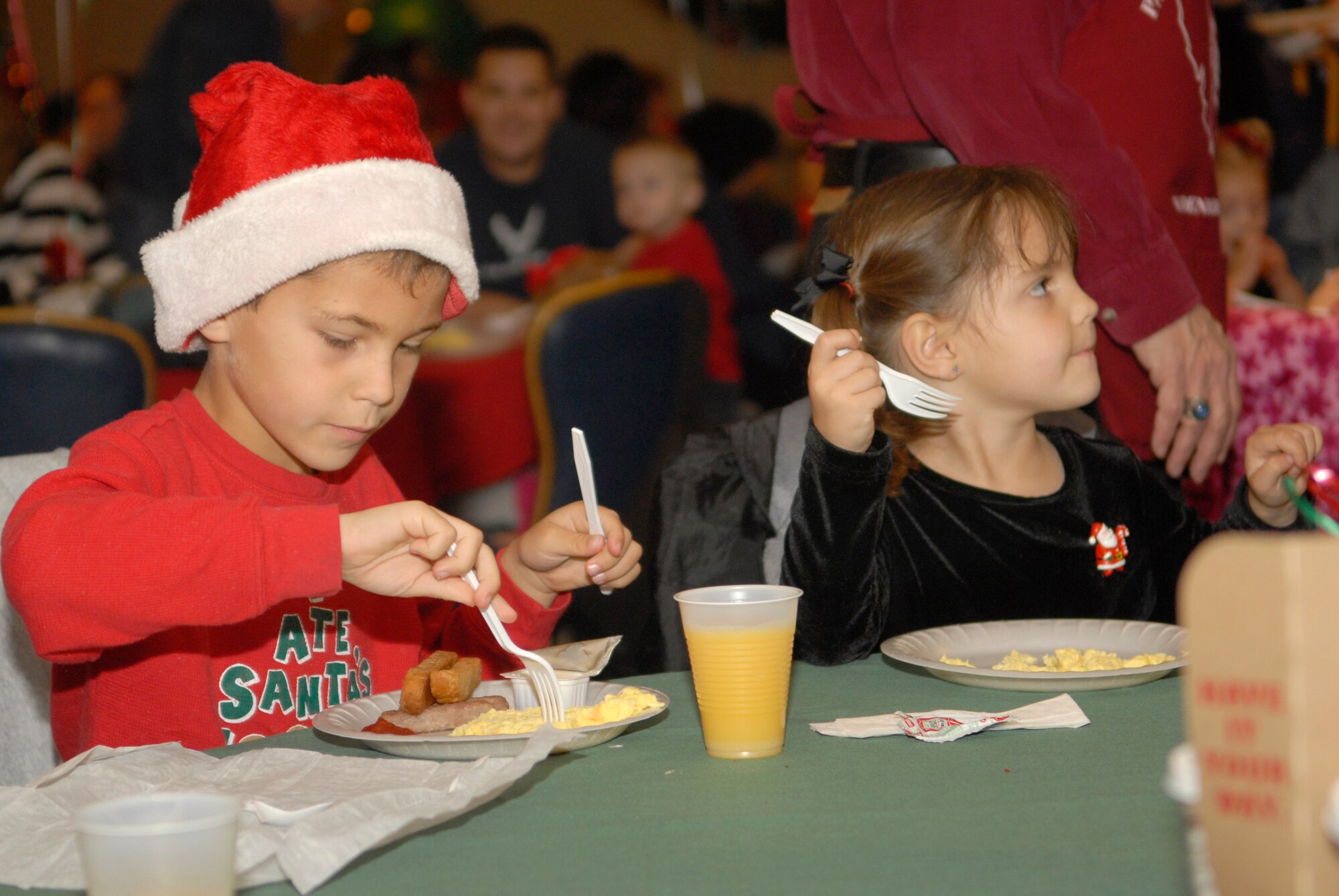 VANDENBERG AIR FORCE BASE, Calif. -- Children enjoy breakfast at the Pacific Coast Club during the Breakfast With Santa event here Saturday, Dec. 18, 2010.  Over 500 families celebrated together during the event.  (U.S. Air Force photo/Senior Airman Andrew Satran) 

 