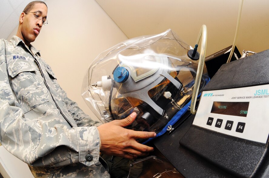 Airman 1st Class Stephen Walker, 2nd Logistics Readiness Squadron, uses a Joint Service Mask Leakage Tester to ensure the gas masks are not faulty and serviceable for deployments and training purposes Dec. 23 at Barksdale Air Force Base, La. The JSMLT provides the operator with an audible and visual indication if a component is defective or if the fit does not meet accepted service specific standards. (U.S. Air Force photo/Senior Airman Brittany Y. Bateman)(RELEASED)