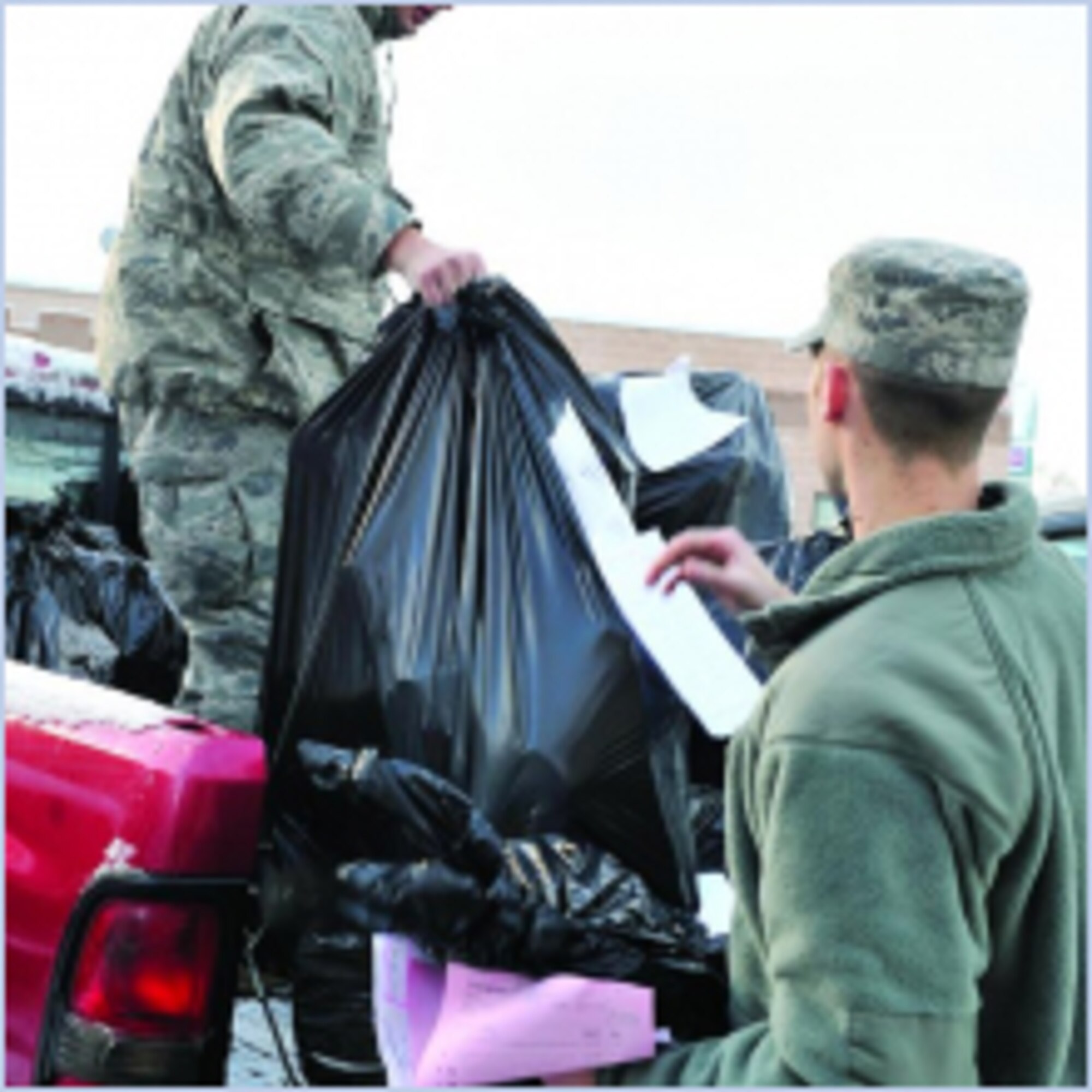 Staff Sgt. Josh Thomas, 419th MXS(left) and Staff Sgt. Shane Olsen, 419th MXS, load a truck to deliver presents for the "Christmas Tree" event with Utah Foster Care Foundation on Dec. 15. (U.S. Air Force photo by Kim Cook)