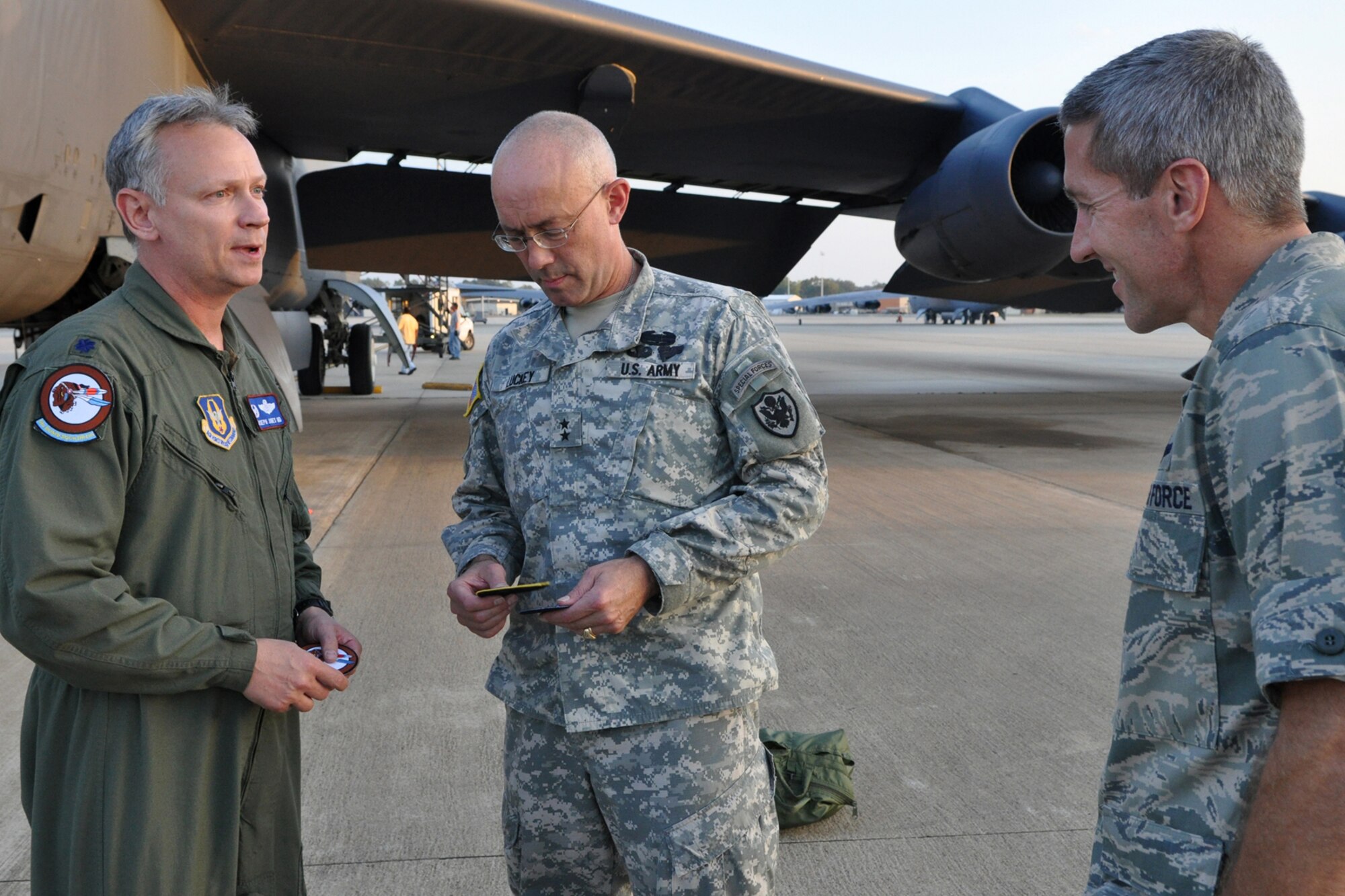 Lt. Col. Joseph Jones, commander of the 93rd Bomb Squadron at Barksdale Air Force Base, La., presents squadron patches to Maj. Gen. Charles D. Luckey and Lt. Col. John Larson, after a training sortie in a B-52 Stratofortress Oct. 27, 2010. General Luckey, who is a U.S. Army officer, is the Assistant to the Chairman of the Joint Chiefs of Staff for Reserve Matters. He was visiting the 917th Wing at Barksdale to get a general feel for issues affecting the Reserve component. Colonel Larson is the strategic planner, ACJCS for NGRM, Assistant to the Chairman of the Joint Chiefs of Staff for Reserve Matters. This was his first flight in a B-52. (U.S. Air Force photo/Tech. Sgt. Jeff Walston) 