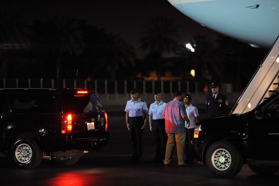 President Barack Obama departs the 15th Wing, Joint Base Pearl Harbor-Hickam, Hawaii, in a motorcade Dec. 22. General Gary North, Pacific Air Forces commander, Col. Sam Barrett, 15th Wing commander and Capt. Tyisha Owens, PACAF Protocol officer, greeted the President upon his arrival. The President and his family are expected to stay in Hawaii through the new year. (U.S. Air Force photo/Staff Sgt. Nathan Allen)