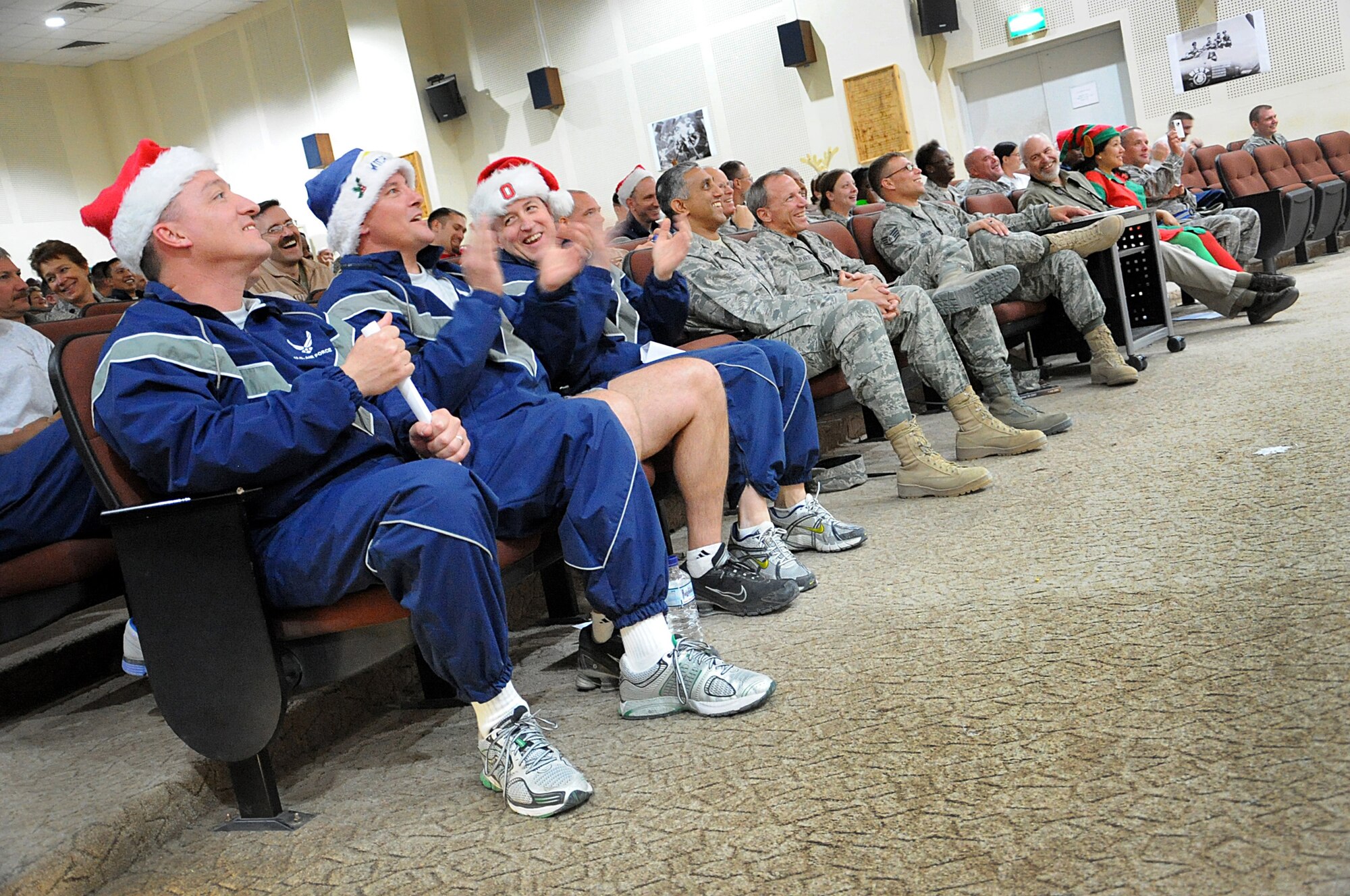 SOUTHWEST ASIA --386th Air Expeditionary Wing leadership joined Airmen in a Christmas caroling contest at the base theater Dec. 20. The caroling competition was one of the many scheduled events to boost the holiday spirit of Airmen deployed during the holidays. (Air Force photo by Senior Airman Cynthia Spalding)