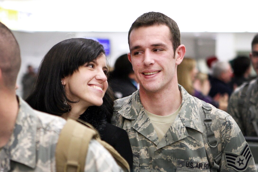Julia Morris admires her husband, Air Force Staff Sgt. Travis Morris, at the Baltimore Washington International Thurgood Marshall Airport, Md., Dec. 22, 2010. Travis returned home in time for the holidays after a seven-month deployment to Afghanistan. DOD photo by Army Sgt. 1st Class Michael J. Carden