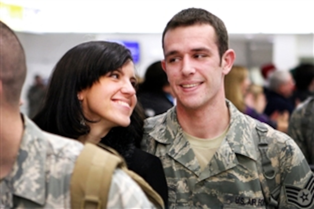 Julia Morris admires her husband, U.S. Air Force Staff Sgt. Travis Morris, at the Baltimore-Washington International Thurgood Marshall  Airport, Md., Dec. 22, 2010. Travis returned home  in time for the holidays after a seven-month deployment to Afghanistan.