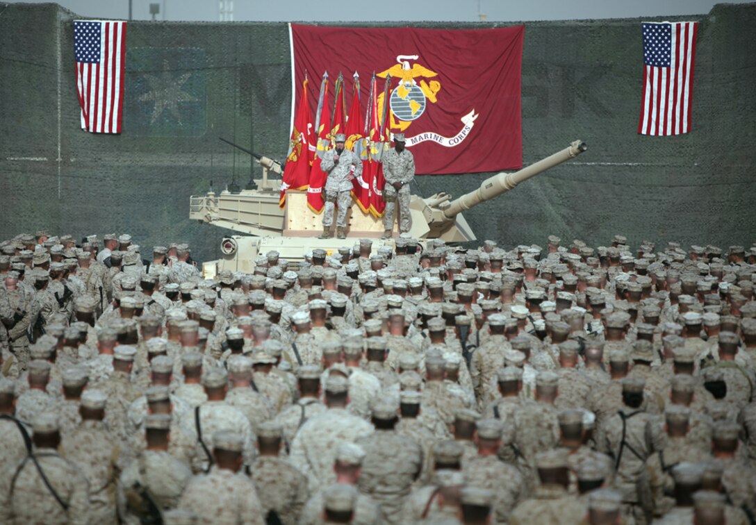 Commandant of the Marine Corps, James F. Amos and Sergeant Major of the Marine Corps Carlton W. Kent, address a crowd of Marines and sailors at Camp Leatherneck, Afghanistan, Dec.. 23.  Amos and Kent visited to say thanks to all the troops who are supporting the International Security Assistance Force and to wish them a happy holiday.