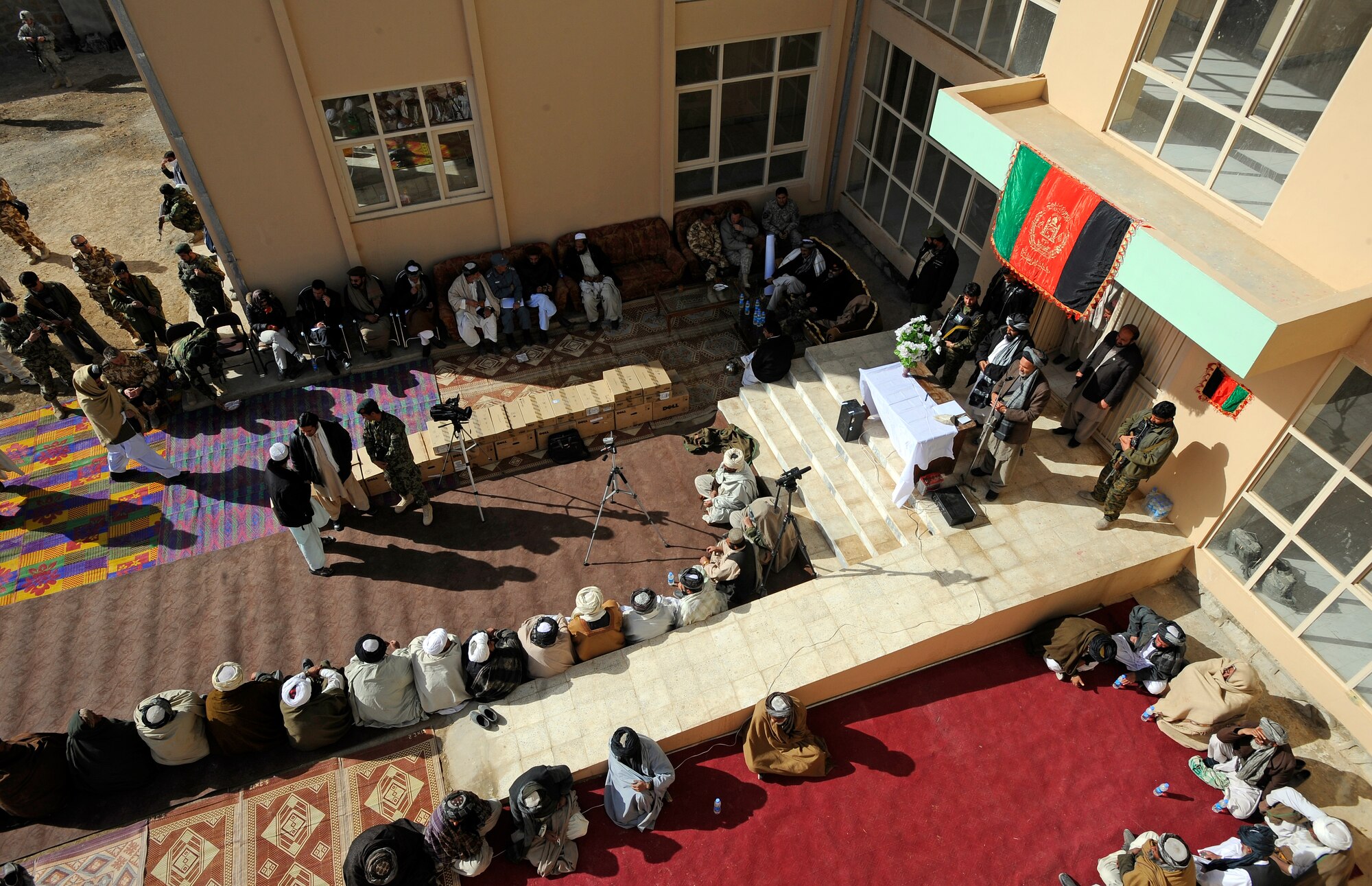 Shajoy District elders listen as Zabul Provincial Gov. Ashraf Naseri speaks during the opening of the Shajoy District Center, Dec. 23. Provincial leaders were on hand to open the district center and speak to the more than 90 local villagers in attendance. (U.S. Air Force photo/Staff Sgt. Brian Ferguson) (Released).