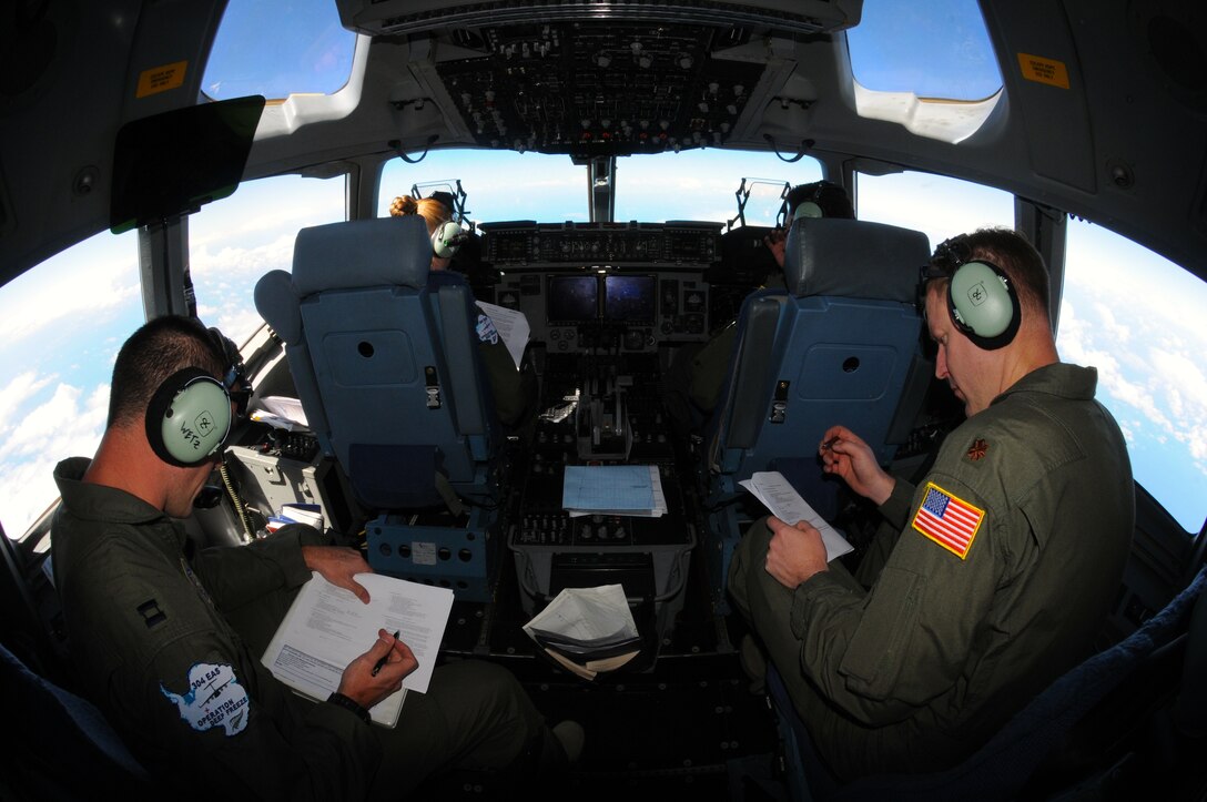 A C-17 Globemaster III aircrew conducts periodic weather checks Dec. 25, 2010, during a flight from Christchurch, New Zealand, to McMurdo Air Station, Antarctica. The aircraft is assigned to the Air Force Reserve Command’s 728th Airlift Squadron at McChord Air Force Base, Wash. The flight was turned around as bad weather made it too difficult to land in Antarctica. (U.S. Air Force photo/Master Sgt. Lee Hoover)