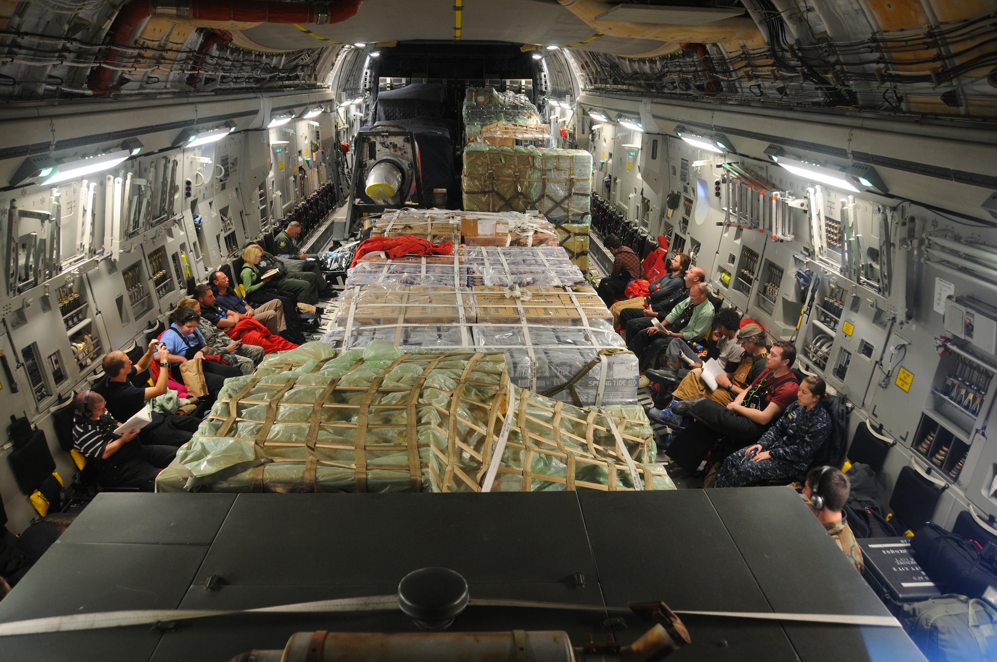 Passengers sit amongst the cargo aboard a C-17 Globemaster III Dec. 25, 2010, during a flight from Christchurch, New Zealand, to McMurdo Air Station, Antarctica.   The aircraft is assigned to the Air Force Reserve Command’s 728th Airlift Squadron at McChord Air Force Base, Wash.  The flight was turned around as bad weather made it too difficult to land in Antarctica.  (U.S. Air Force photo/Master Sgt. Lee Hoover)