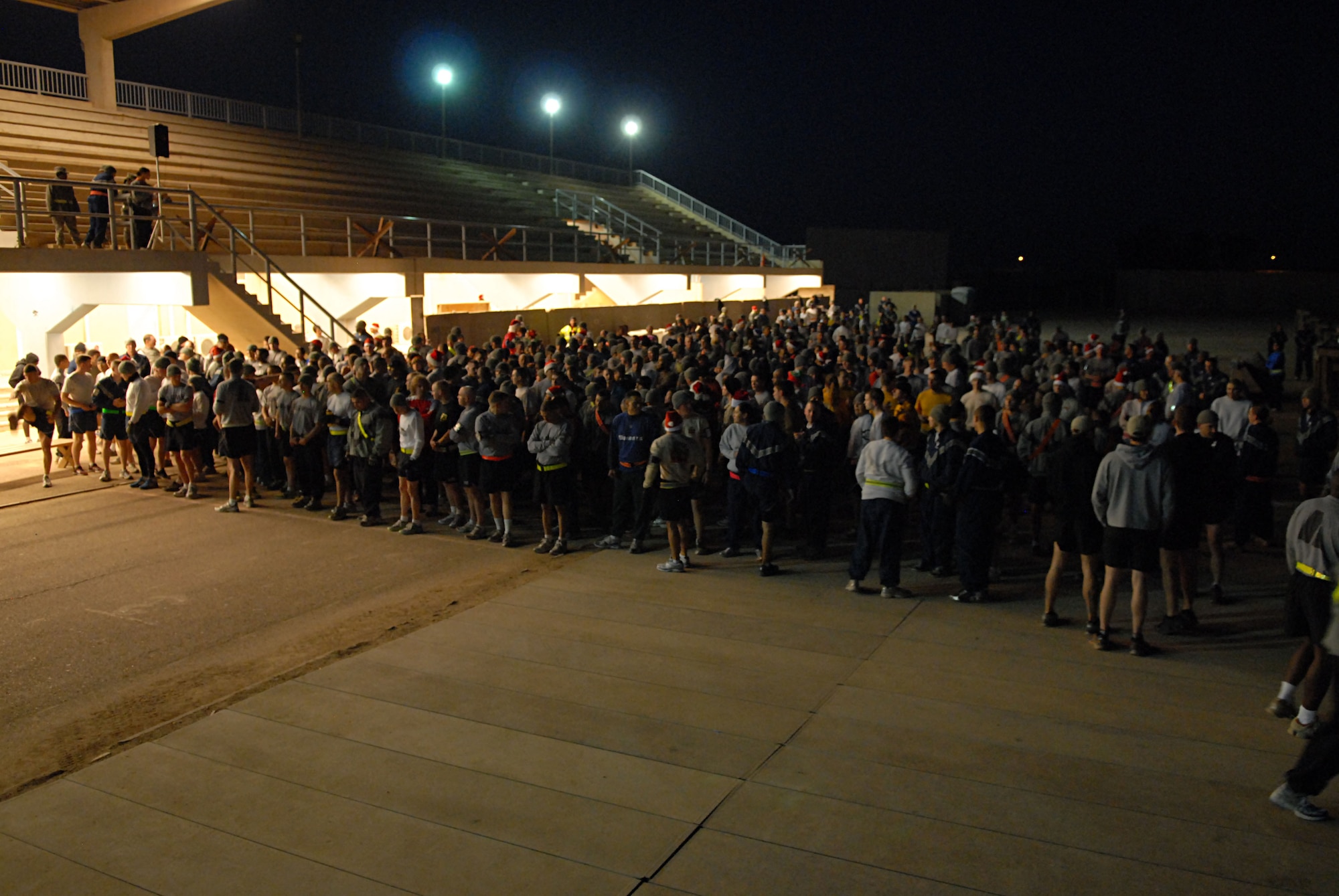 JOINT BASE BALAD, Iraq -- More than 400 Soldiers, Sailors, Airmen and Marines braved the cold to participate in the Jingle Bell 5K run at Holt Stadium on Christmas morning. The event was sponsored by the 332nd Expeditionary Force Support Squadron and the first 350 runners to finish received a t-shirt.  (U.S. Air Force photo/ Senior Airman Tong Duong)