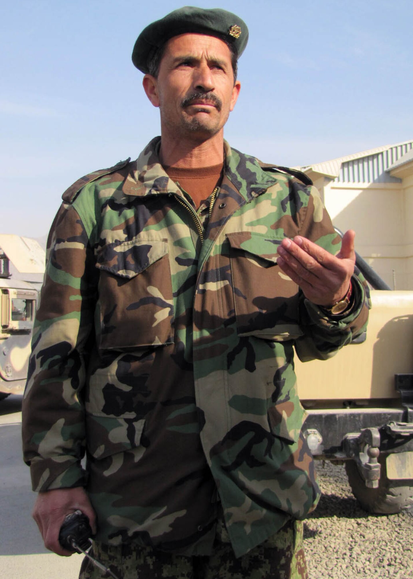 101225-N-6541W-047 KABUL, Afghanistan - Capt. Matin, the Afghan Air Force quick reaction force commander, speaks to members of the Afghan Air Force and members of the 438th Air Expeditionary Advisory Squadron Security Forces advisors during an after action report after they conducted an AAF Security Kandak exercise at the Afghan Air Force Base in Kabul, Afghanistan.  (U.S. Navy photo by Mass Communication Specialist 3rd Class Jared Walker/ RELEASED).