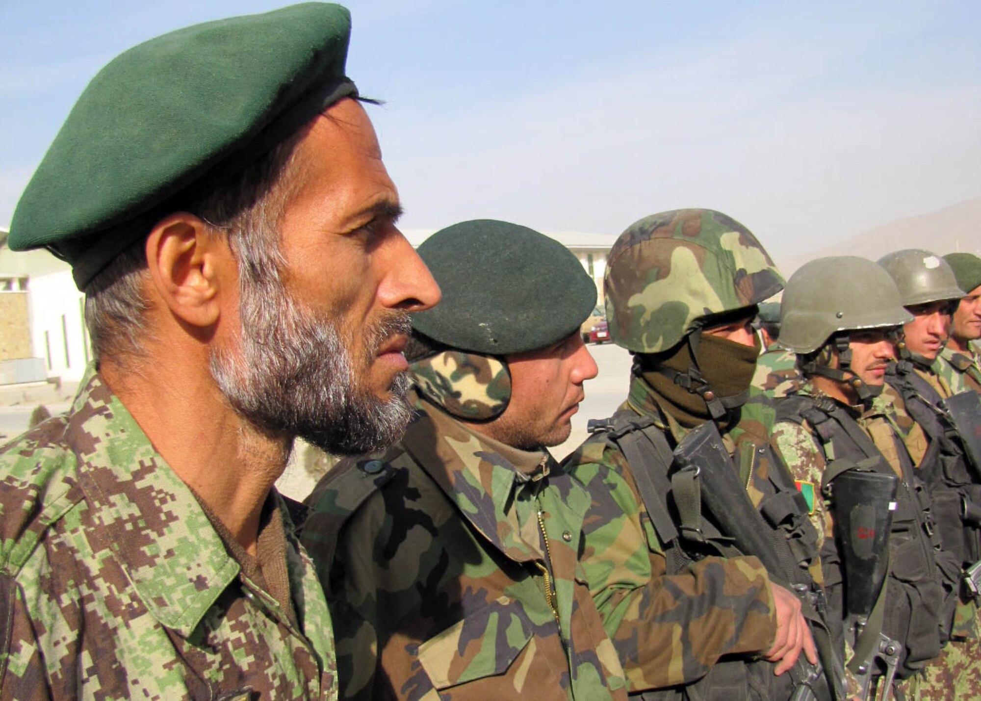 101225-N-6541W-036 KABUL, Afghanistan - Members of the Afghan Air Force and members of the 438th Air Expeditionary Advisory Squadron Security Forces advisors have an after action report after they conducted an AAF Security Kandak exercise at the Afghan Air Force Base in Kabul, Afghanistan.  (U.S. Navy photo by Mass Communication Specialist 3rd Class Jared Walker/ RELEASED).