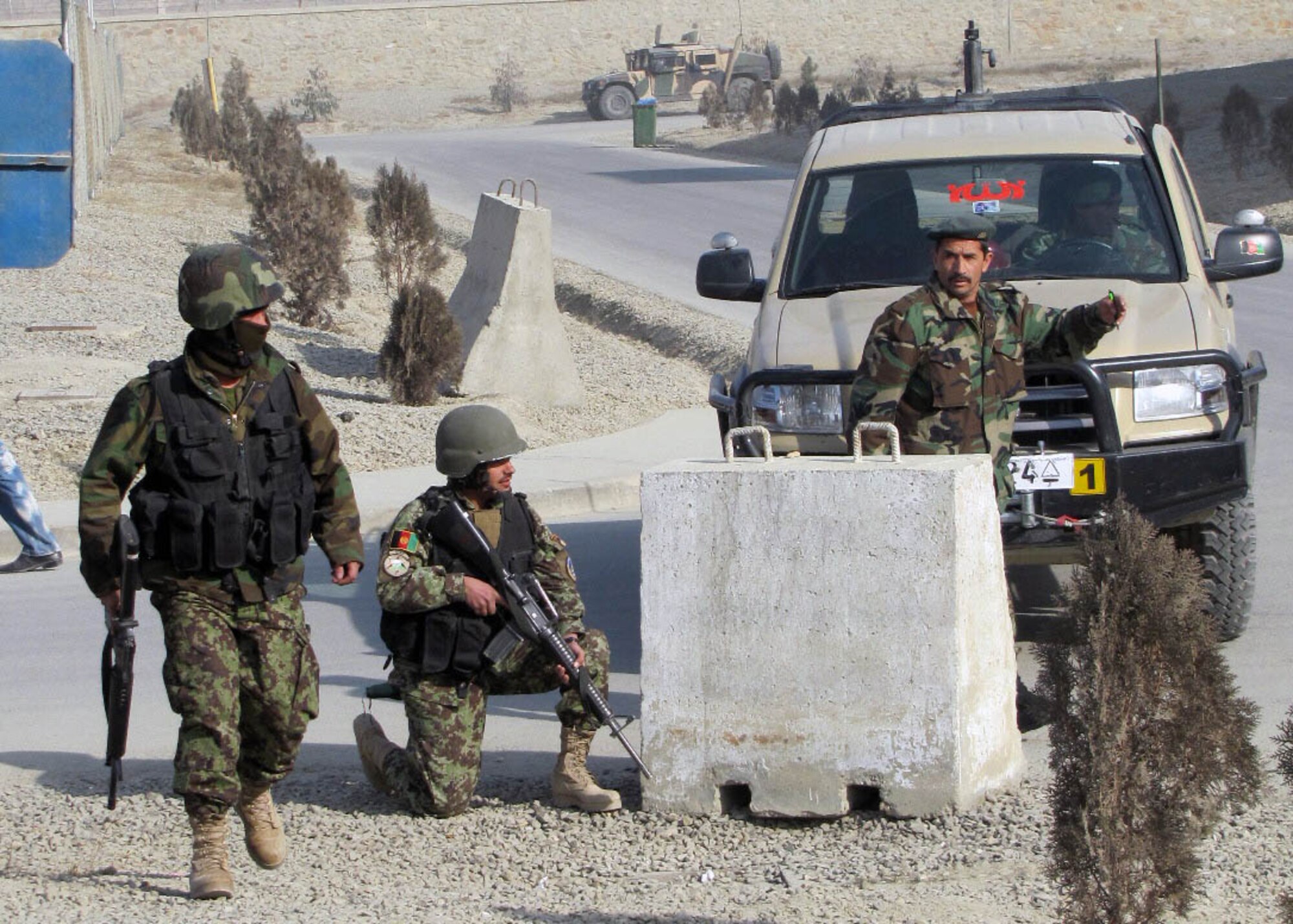 101225-N-6541W-012 KABUL, Afghanistan - Members of the Afghan Air Force and members of the 438th Air Expeditionary Advisory Squadron Security Forces advisors conducted an AAF Security Kandak exercise at the Afghan Air Force Base in Kabul, Afghanistan.  (U.S. Navy photo by Mass Communication Specialist 3rd Class Jared Walker/ RELEASED).