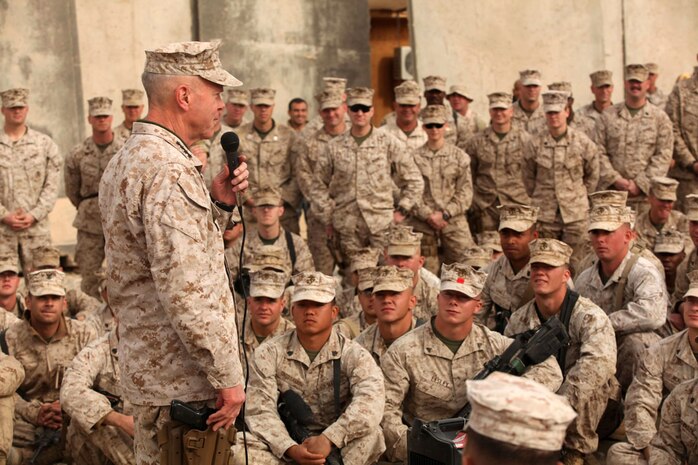 General James F. Amos, 35th Commandant of the Marine Corps, speaks to the Marines and sailors of Regimental Combat Team 2, wishing them a Merry Christmas, aboard Forward Operating Base Delaram II, Dec. 25, 2010. Traveling with the Sergeant Major of the Marine Corps, Sgt. Maj. Carlton W. Kent, Amos shared a Christmas meal with RCT-2, expressing that there was no other place he would rather be than with Marines in Afghanistan celebrating the Christmas holiday.