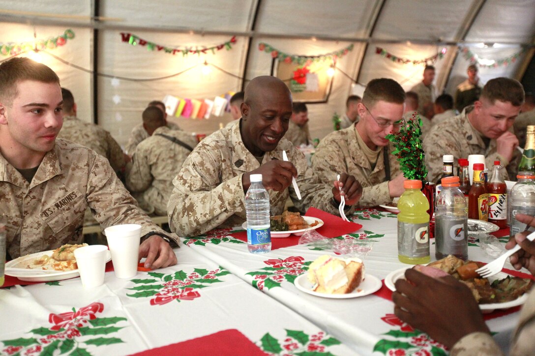 Sgt. Maj. Carlton Kent, Sgt. Maj. of the Marine Corps, shares a Christmas meal with the Marines and sailors of Regimental Combat Team 2, during his visit with them aboard Forward Operating Base Delaram II, Dec. 25, 2010. Kent traveled with General James F. Amos, 35th Commandant of the Marine Corps, to wish RCT-2 a Merry Christmas; thanking them for carrying on the Marine Corps legacy here in Afghanistan.