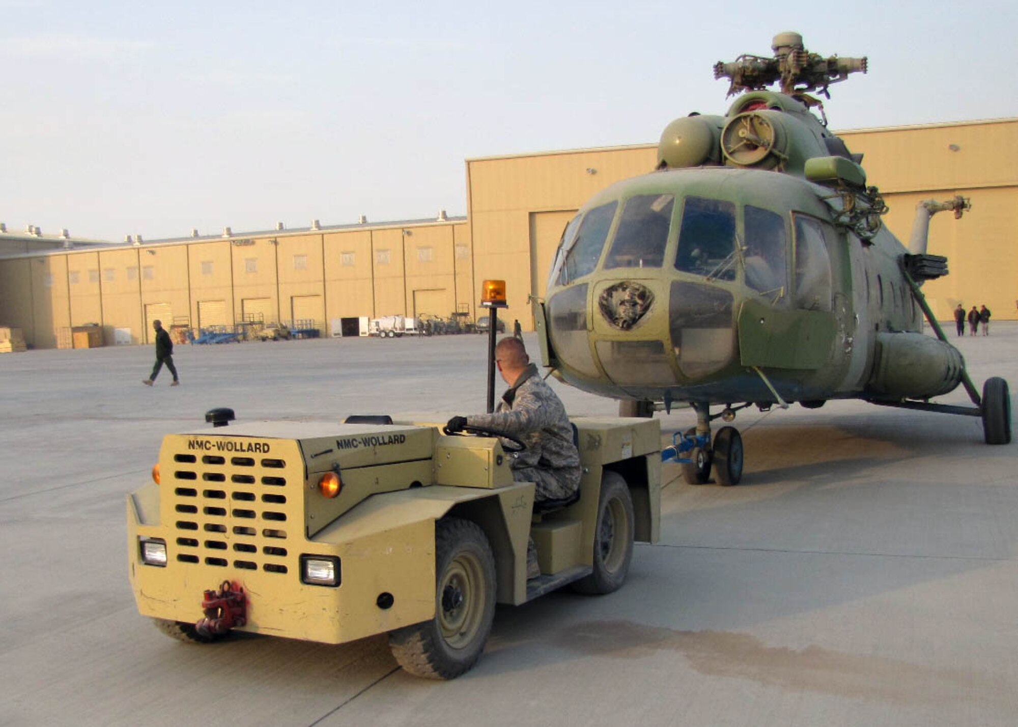 KABUL, Afghanistan -   An Afghan Air Force Mi-17 transport aircraft being towed so it can be loaded onto an An-124 at the Afghan Air Force Base in Kabul, Afghanistan Dec.26. The Afghan Air Force does not have the capability yet to overhaul the aircraft so the aircraft will be shipped to the contractors facility. (U.S. Navy photo by Mass Communications Specialist Third Class Petty Officer Jared E. Walker/ RELEASED).