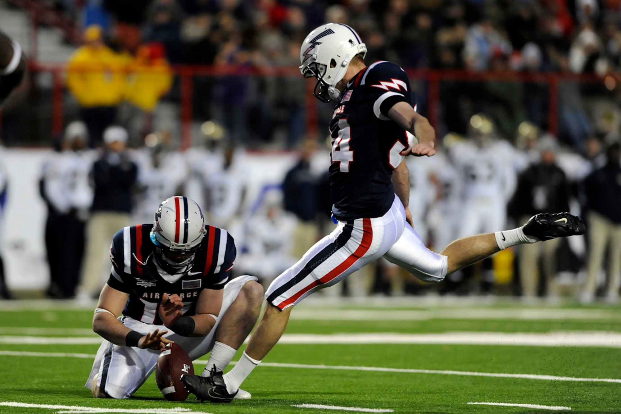 Air Force kicker Zack Bell kicks a 41-yard field goal to give the Falcons their first points of the game in the Advocare V100 Independence Bowl against Georgia Tech Dec. 27, 2010. Bell, a native of Darien, Ill., hit field goals from 41 and 42 yards in the first half, paving the way for a 14-7 Air Force victory. (U.S. Air Force photo/Mike Kaplan)