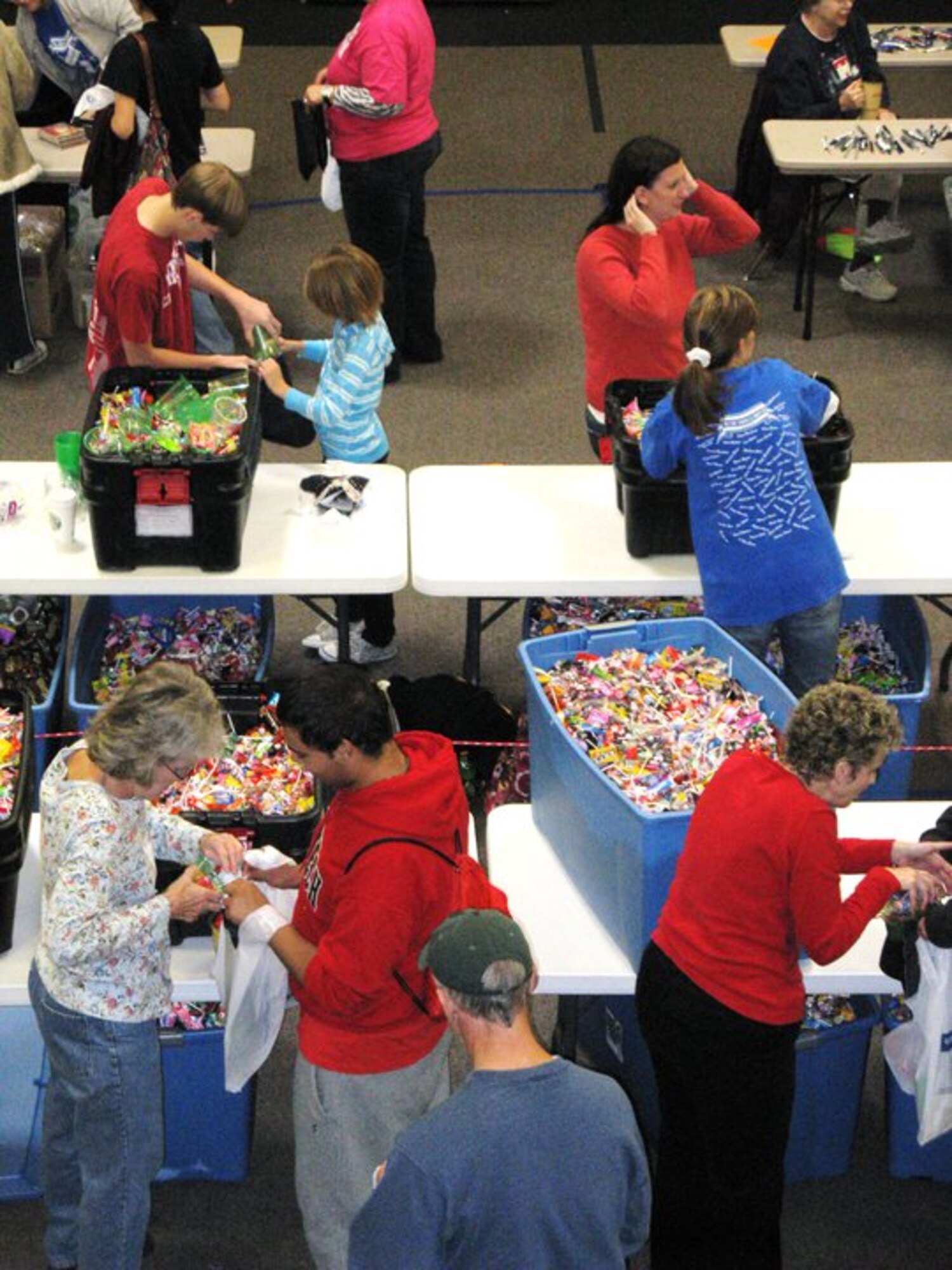 LUBBOCK, Texas -- Volunteers from the Westminster Presbyterian Church in Lubbock, Texas, fill more than 3,000 handmade stockings to donate to Airmen at Kunsan Air Base, Republic of Korea. The stockings were then packed into more than 700 boxes and shipped to Capt. Jeff Fowlkes, 8th Civil Engineer Squadron, for distribution to the Wolf Pack on Dec. 25. (Courtesy photo)