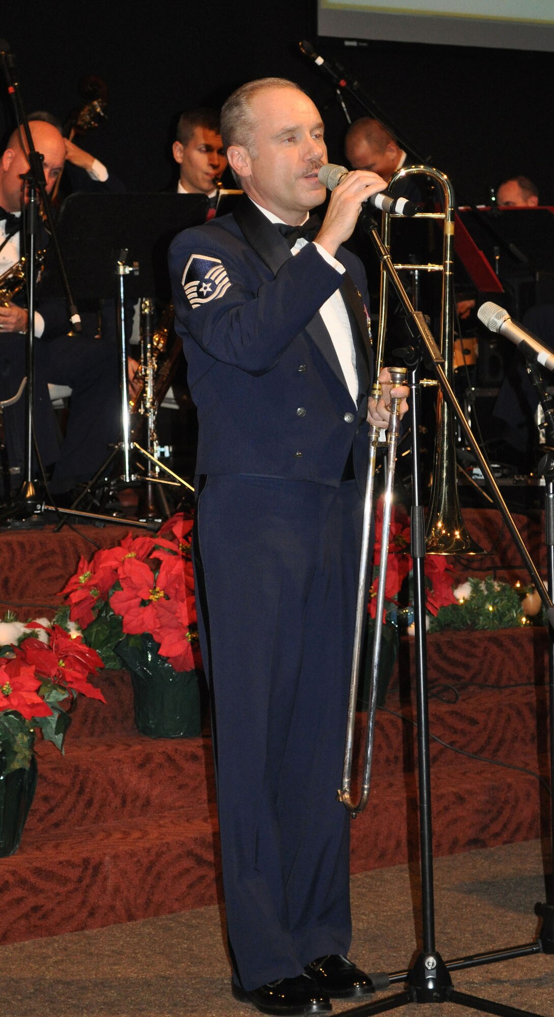 TRAVIS AIR FORCE BASE, Calif. -- Master Sgt. Thomas Eckert sings at his last concert with the Band of the Golden West Dec. 7, 2010. A vocalist and trombonist, he is retiring after more than 26 years of service to the U.S. Air Force. He sang "Christmas Love Song" as his musical holiday card for an audience, and his fellow band Airmen, in Fairfield. (U.S. Air Force photo/Senior Master Sgt. Ellen L. Hatfield)