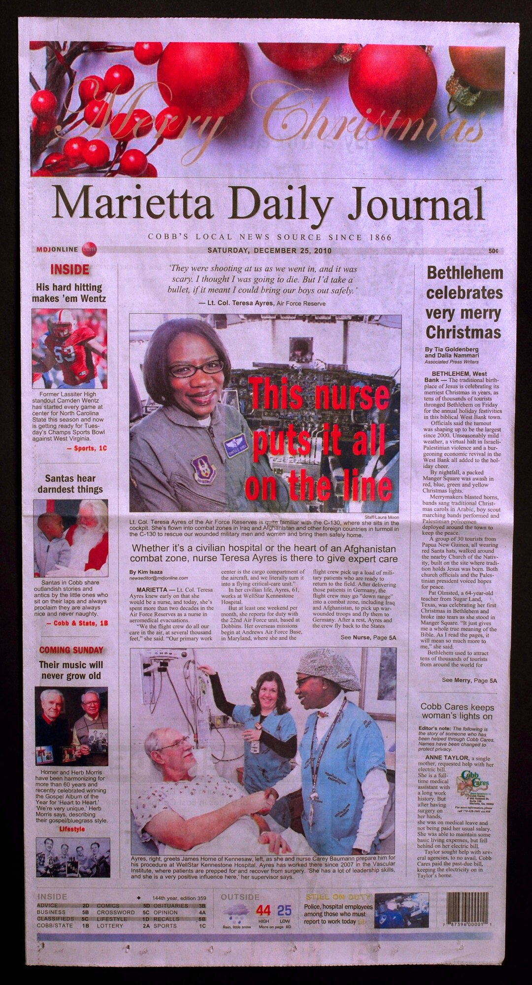 A story about Lt. Col. Teresa C. Ayres, an Air Force Reserve flight nurse with the 514th Aeromedical Evacuation Squadron appeared on the front-page of the  Marietta Daily Journal.  In civilian life Colonel Ayres is a nurse in the Vascular Institute at WellStar Kennestone Hospital in Marietta and travels to Joint Base McGuire-Dix-Lakehurst, N.J. for her reserve duty.  The Marietta Daily Journal ran an extensive Christmas day front-page story about her service to the community and over 21 years to the nation.  (U.S. Air Force photo/ Brad Fallin)