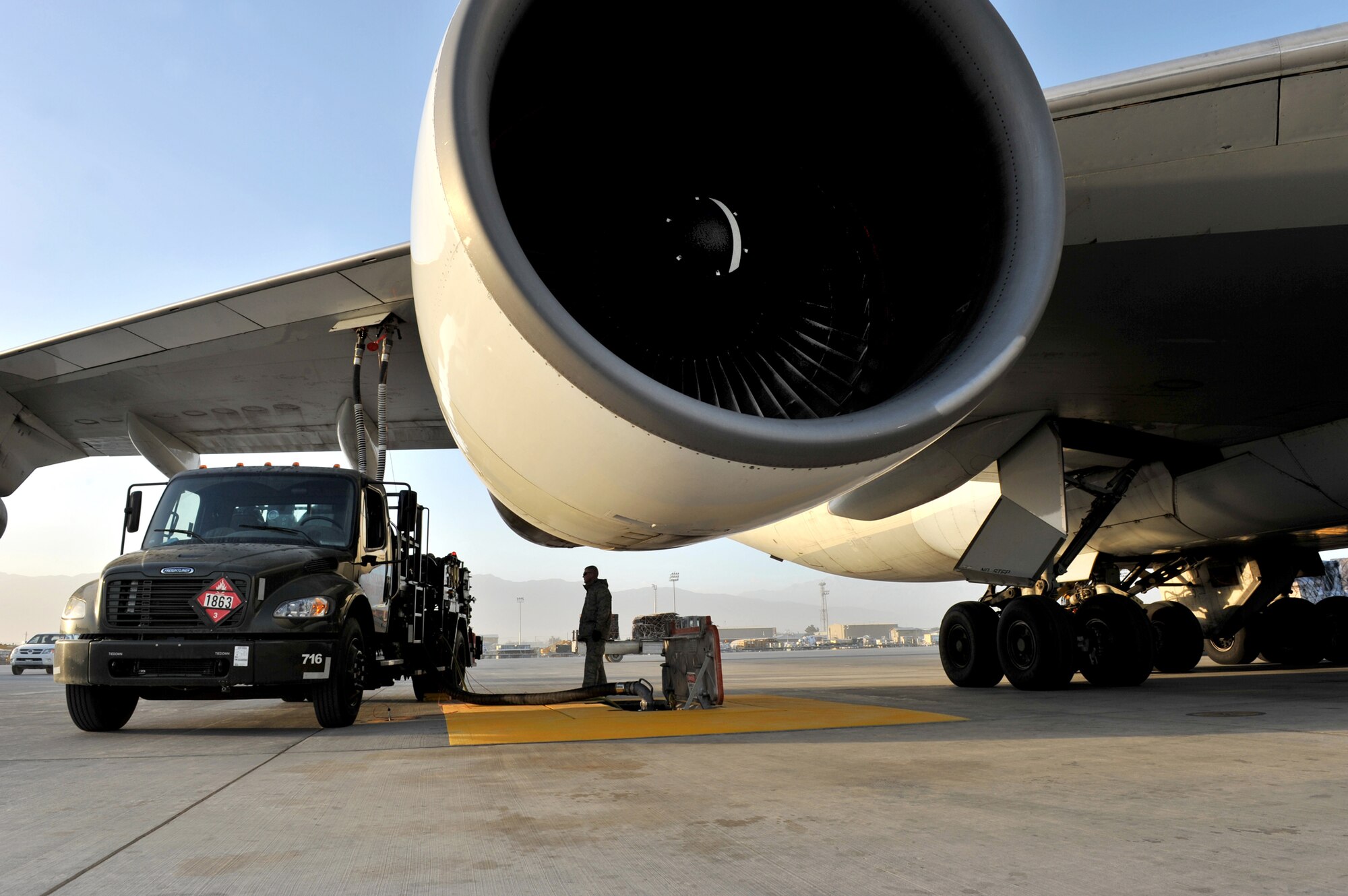 Tech. Sgt. Jeremy Whitworth watches the pressure gauge while refueling an aircraft with the new R-12 hydrant-servicing vehicle Dec. 21, 2010, at Bagram Airfield, Afghanistan. The squadron recently received five HSVs and completed the new Type III constant pressure system became fully operational and will significantly increase refueling capabilities. Sergeant Whitworth is the 455th Expeditionary Logistics Readiness Squadron section chief of fuels refueling. (DOD photo/Senior Airman Sheila deVera)