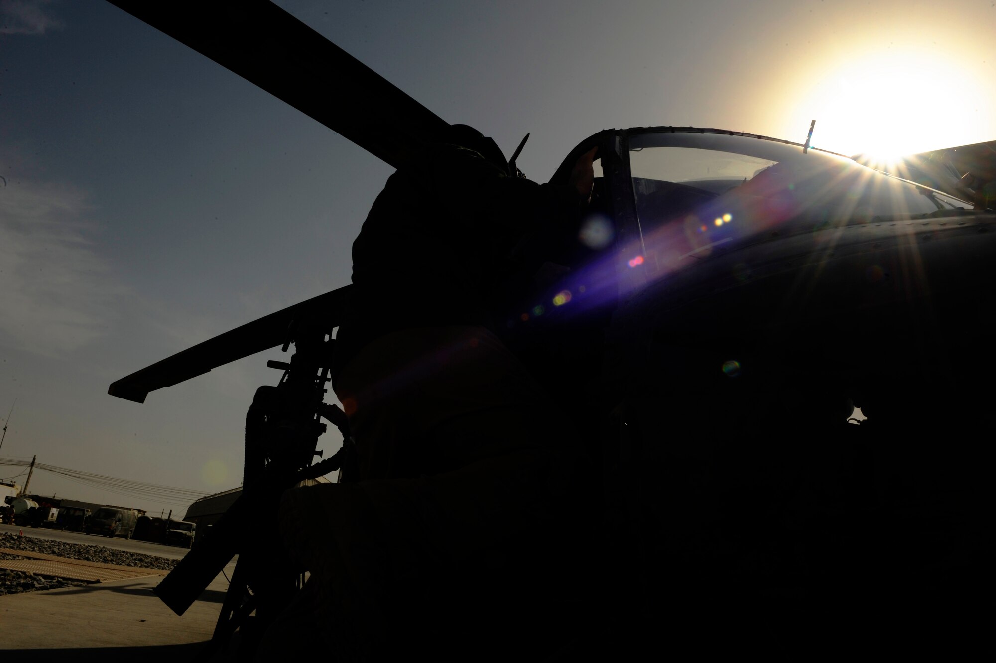 U.S. Air Force Capt. David Fink, 26th Expeditionary Rescue Squadron, conducts pre-flight checks on an HH-60 Pave Hawk in order to be ready for a mission at a moment's notice at Kandahar Airfield, Afghanistan, Dec. 25, 2010. The rescue squadrons are on alert 24/7 including holidays like Christmas. (U.S. Air Force photo by SSgt. Eric Harris, U.S. Air Forces Central Public Affairs / Released.)