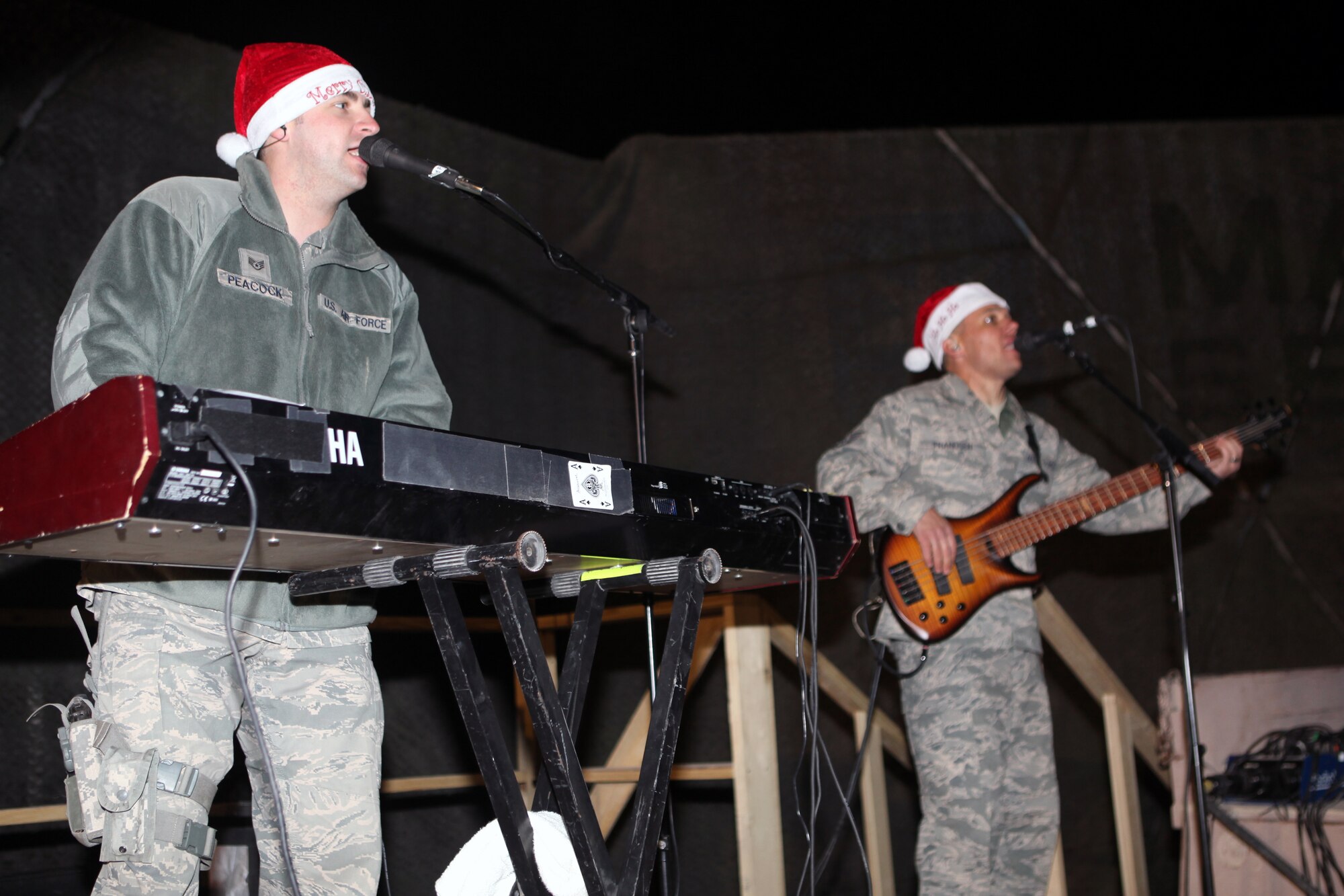 Staff Sgt. Matthew Peacock (left) and Tech. Sgt. Mark Frandsen, U.S. Air Forces Central Band, Touch ‘n Go, perform for servicemembers at Camp Leatherneck, Afghanistan, Dec. 22. (U.S. Air Force photo/Master Sgt. Brian Jones)