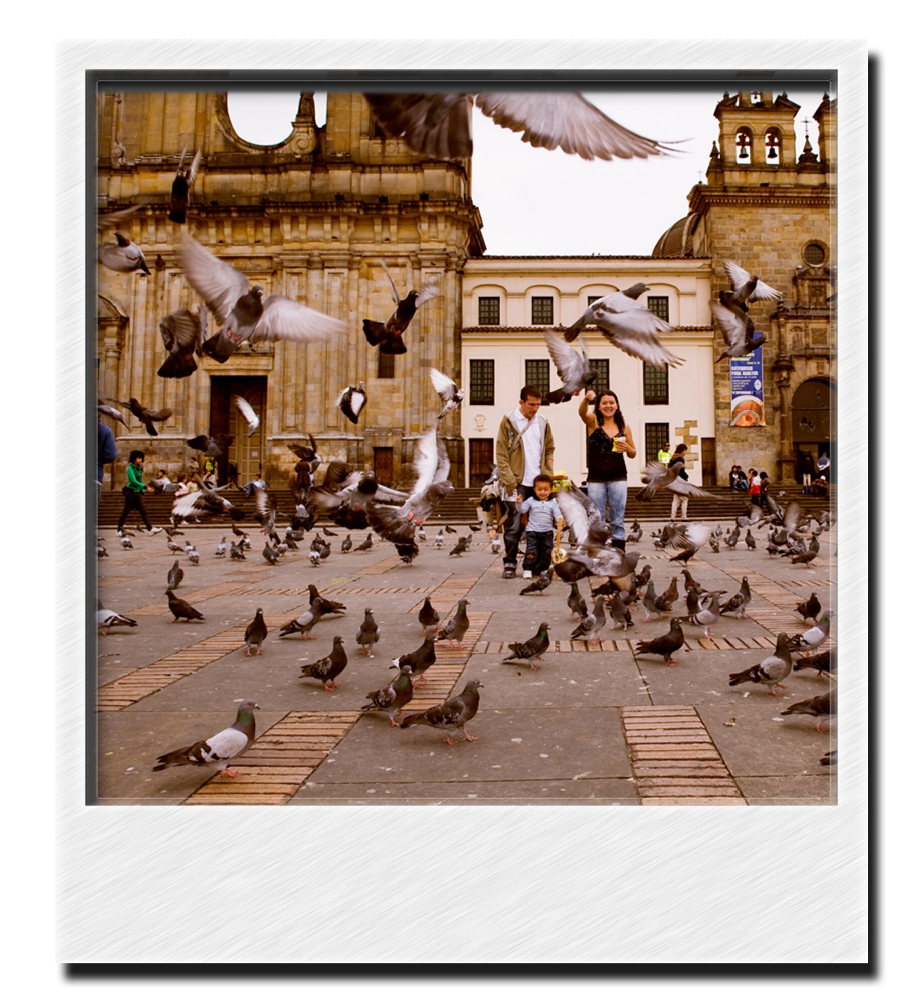 A Traveling Abroad -  feed pigeons in front of the Prime Cathedral, Bolivar Plaza, Bogota. (Photo by TSgt Samuel Bendet)