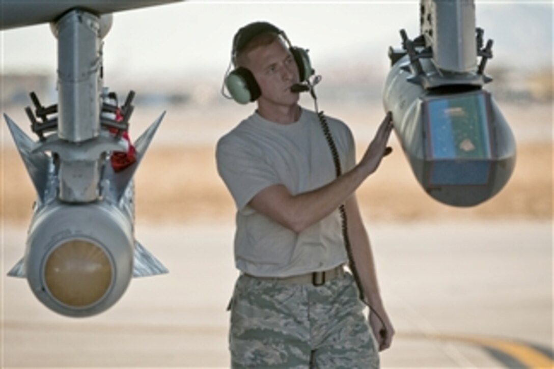 Staff Sgt. Jamie Case looks over a targeting pod attached to an A-10 Thunderbolt II aircraft during the Green Flag West 11-2 exercise at Nellis Air Force Base, Nev., on Dec. 6, 2010.  Case is with the 23rd Aircraft Maintenance Squadron at Moody Air Force Base, Ga.  