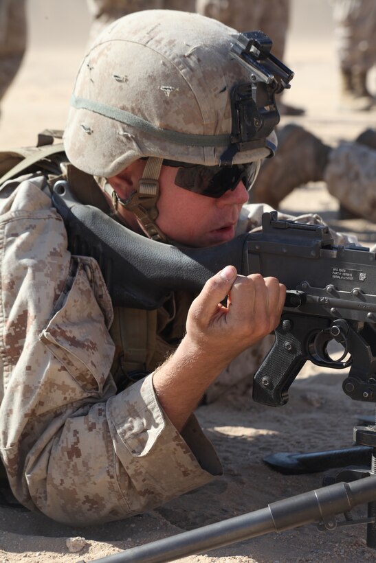 Lance Corporal Samuel R. Shives, an infantryman with 1st Platoon, Company L, Battalion Landing Team 3/8, 26th Marine Expeditionary Unit, practices misfire procedures on an M240B machinegun prior to a battle sight zero firing exercise aboard Camp Buehring, Kuwait, Dec. 28, 2010. Elements of 26th MEU disembarked the ships of Kearsarge Amphibious Ready Group to conduct sustainment training in various Middle Eastern and African countries. (Official USMC photo by Sgt. Jesse J. Johnson/ Released) ::r::::n::