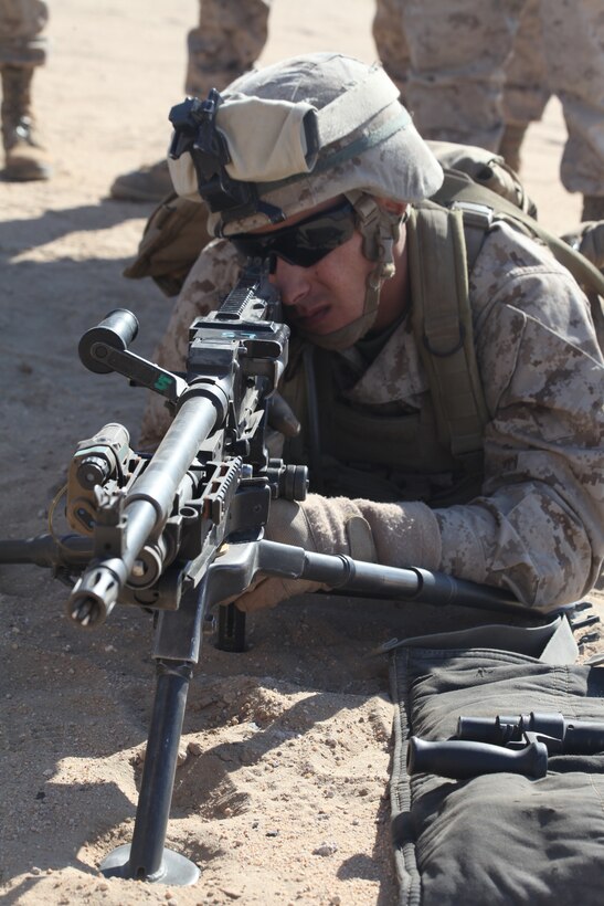 Lance Corporal Michael L. Paugh, an infantryman with 1st Platoon, Company L, Battalion Landing Team 3/8, 26th Marine Expeditionary Unit, practices misfire procedures on a M240B machinegun prior to a battle sight zero firing exercise aboard Camp Buehring, Kuwait, Dec. 28, 2010. Elements of 26th MEU disembarked the ships of Kearsarge Amphibious Ready Group to conduct sustainment training in various Middle Eastern and African countries. (Official USMC photo by Sgt. Jesse J. Johnson/ Released) ::r::::n::::r::::n::