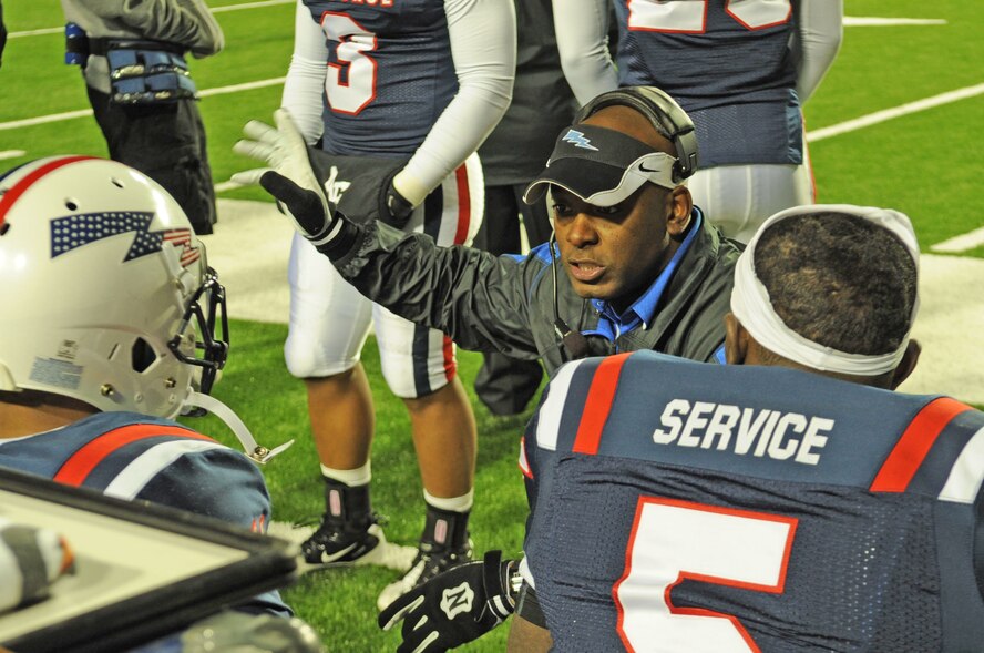 Charlton Warren, Air Force Academy co-defensive, secondary, and receiving coordinator, discuss a previous play with players during the 2010 AdvoCare V100 Independence Bowl at Independence Stadium in Shreveport, La., Dec.28. (U.S. Air Force photo/Airman 1st Class Sean Martin)
