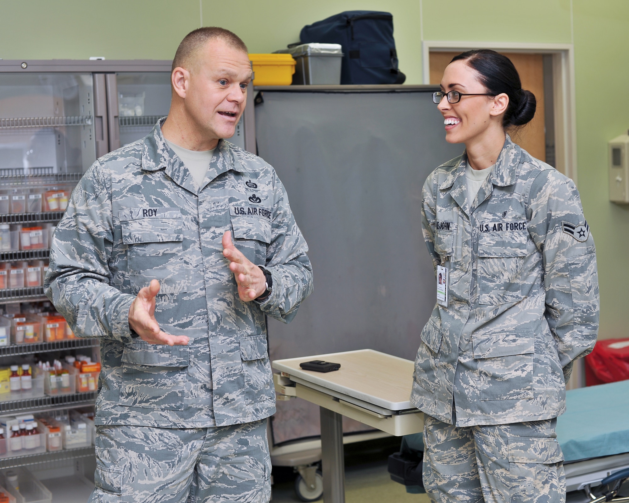 YOKOTA AIR BASE, Japan -- Chief Master Sgt. of the Air Force James Roy asks Airman 1st Class Sarah Littlejohn, 374th Medical Operations Squadron, about the Yokota Urgent Care Center here Dec. 27, during a base visit. Chief Roy was assigned to Yokota Air Base from August 2005 to May 2007 as Command Chief Master Sergeant, U.S. Forces Japan and 5th Air Force.(U.S. Air Force photo/Osakabe Yasuo)