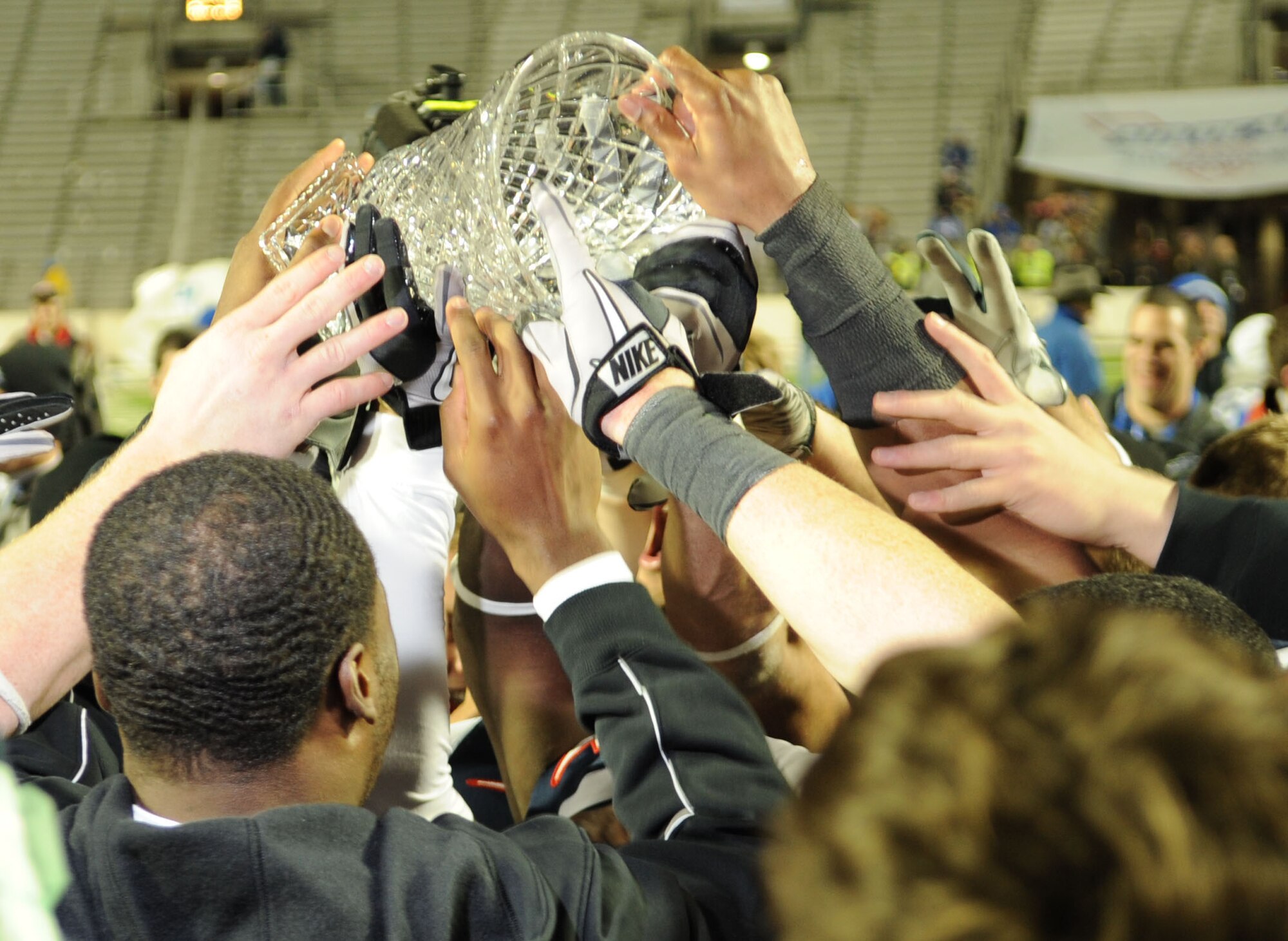 Members of the Air Force Academy football team raise their trophy during the 2010 AdvoCare V100 Independence Bowl at Independence Stadium in Shreveport, La., Dec.28. The AFA Falcons edged out the Georgia Tech Yellow Jackets with a score of 14-7. (U.S. Air Force photo/Airman 1st Class Sean Martin)(Released)