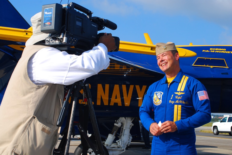 Captain Greg McWherter, Blue Angels #1 and squadron commander is interviewed by local media shortly after arriving at Dobbins Air Reserve Base Oct. 14.  The Blue Angels will fly their exciting demonstration during the Wings Over Atlanta 2010 Air Show.  (U.S. Air Force photo/ Brad Fallin)