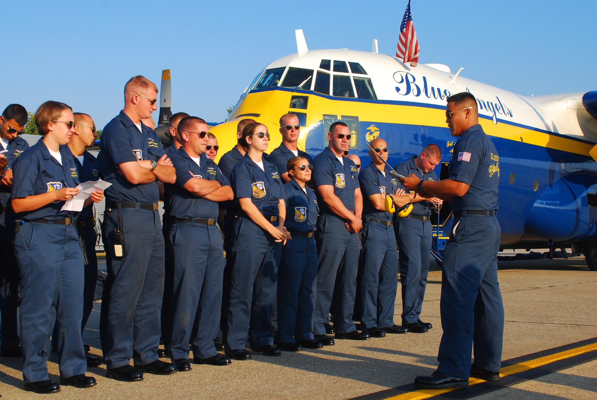Blue Angels support personnel receive a briefing just after arriving on the Dobbins Air Reserve Base ramp Oct. 14.  The Blue Angels will fly their exciting demonstration during the Wings Over Atlanta 2010 Air Show.  (U.S. Air Force photo/ Brad Fallin)
