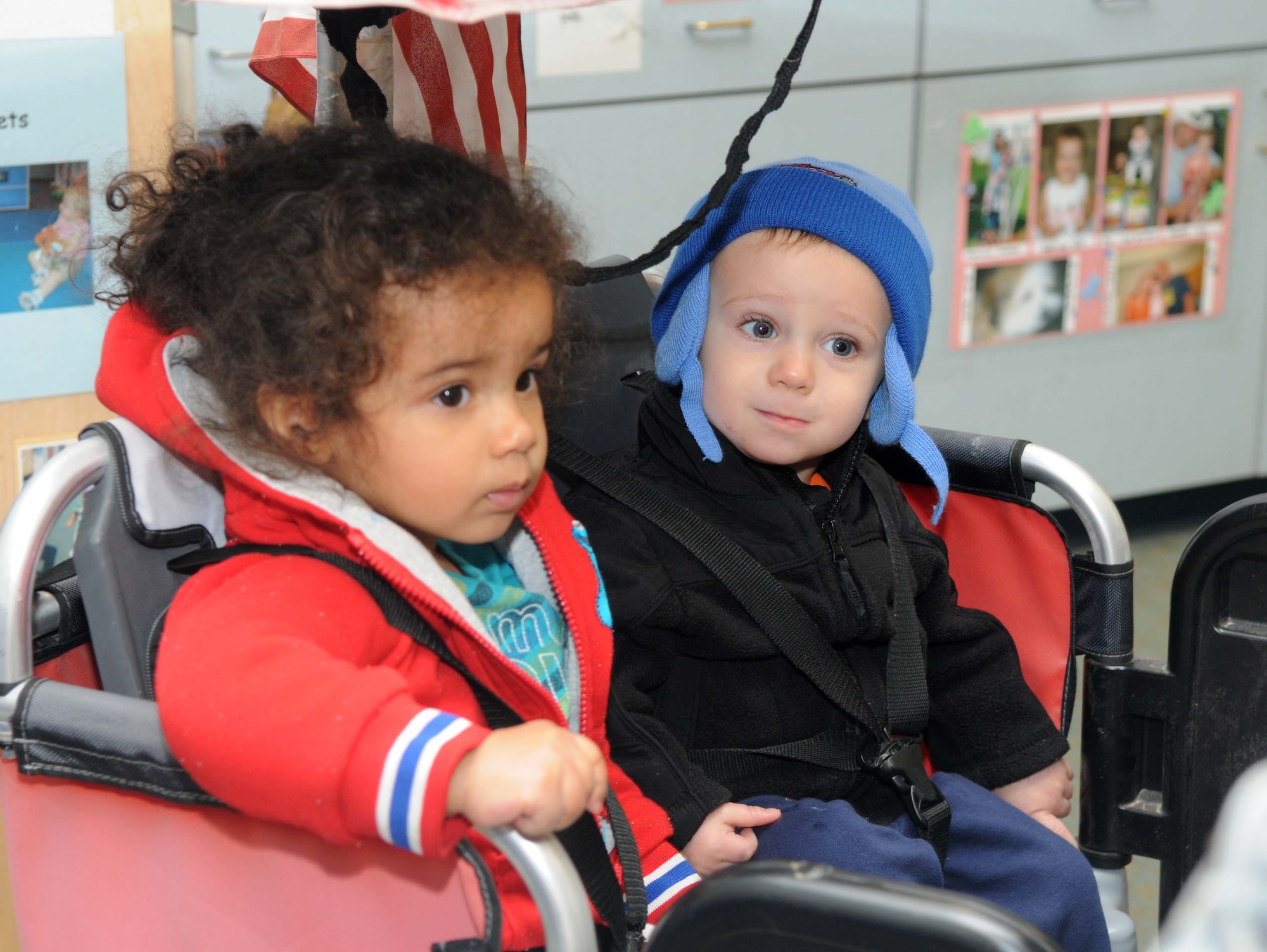 GOODFELLOW AFB, Texas - Right to left, Kiana Trudell and Nicolas Rodgers, both 1 yr old, are prepared to evacuate the Child Development Center during an exercise at Goodfellow AFB, TX, 22 Dec.  The CDC evacuated the children to an alternate location to ensure proficiency in emergency procedures.(U.S. Air Force photo/Staff Sgt. Heather Rodgers)
