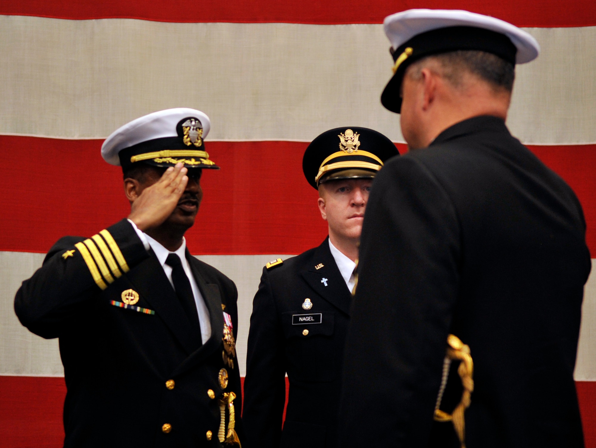 Capt. Marco Cromartie Commanding Officer Navy Region Southwest Reserve Component Command salutes Capt. Leith Wimmer, during the NOSC Denver Change of Command ceremony on Dec. 15, 2010.(U.S. Air Force photo by Airman 1st Class Paul Labbe.) 