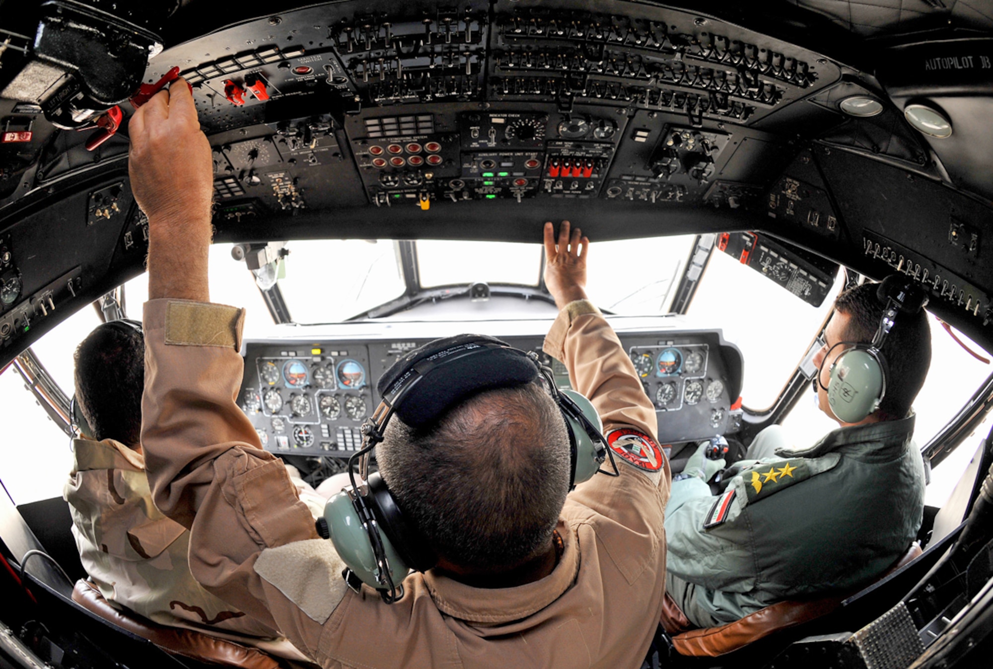 Iraqi Army Aviation Command pilots prepare to fly an Mi-17 helicopter Dec. 14, 2010, in Taji, Iraq. The Mi-17 is one of several helicopters that the AAC has at Taji. Air advisers with the 721st AEAS work with AAC members at Taji to advise and assist them in building a safe, self-sustaining Iraqi rotary-wing force. (U.S. Air Force photo/Senior Airman Andrew Lee)