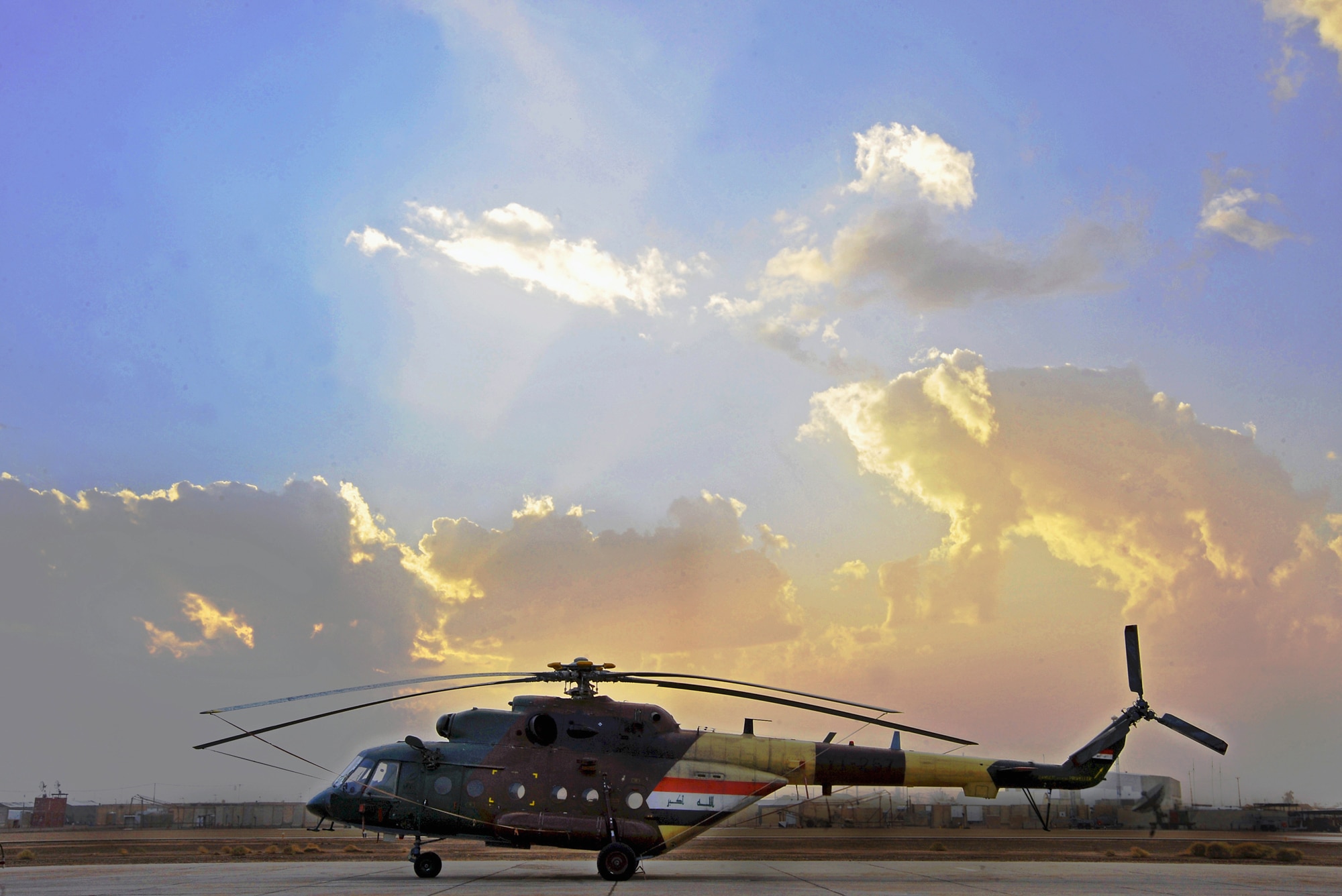 An Iraqi Army Aviation Command Mi-17 helicopter sits Dec. 12, 2010, on the flightline in Taji, Iraq. The Mi-17 is one of several helicopters that the AAC has at Taji. Air advisers with the 721st AEAS work with AAC members at Taji to advise and assist them in building a safe, self-sustaining Iraqi rotary-wing force. (U.S. Air Force photo/Senior Airman Andrew Lee)