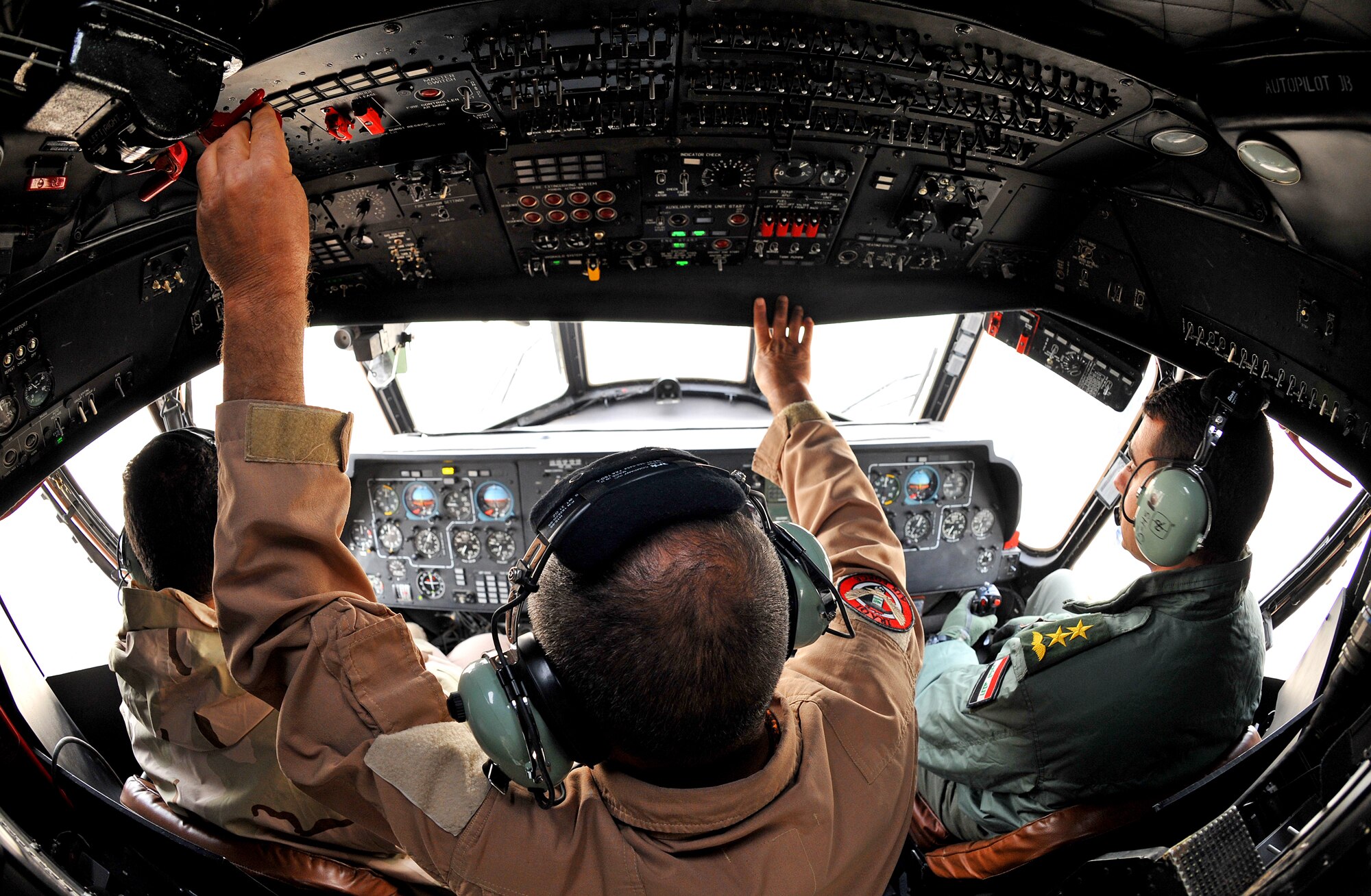 Iraqi Army Aviation Command pilots prepare to fly a Mi-17 helicopter Dec. 14, 2010, in Taji, Iraq. The Mi-17 is one of several helicopters that the AAC have at Taji. 721st Air Expeditionary Advisory Squadron air advisors work with the AAC at Taji to advise and assist them in building a safe, self-sustaining Iraqi rotary-wing force. (U.S. Air Force photo/Senior Airman Andrew Lee)