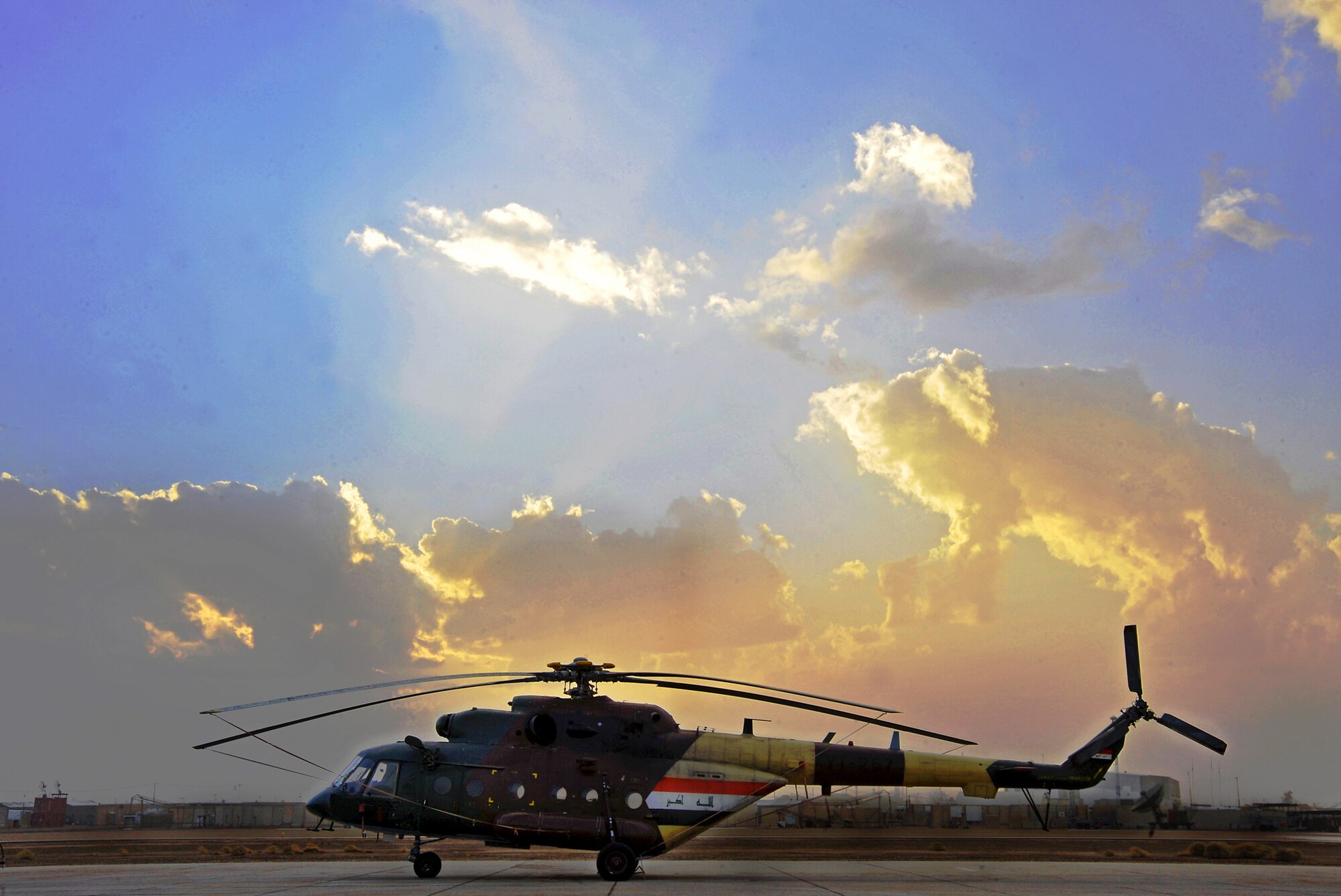 An Iraqi Army Aviation Command Mi-17 helicopter sits on the flightline Dec. 12, 2010, in Taji, Iraq. The Mi-17 is one of several helicopters that the AAC have at Taji. 721st Air Expeditionary Advisory Squadron air advisors work with the AAC at Taji to advise and assist them in building a safe, self-sustaining Iraqi rotary-wing force. (U.S. Air Force photo/Senior Airman Andrew Lee)