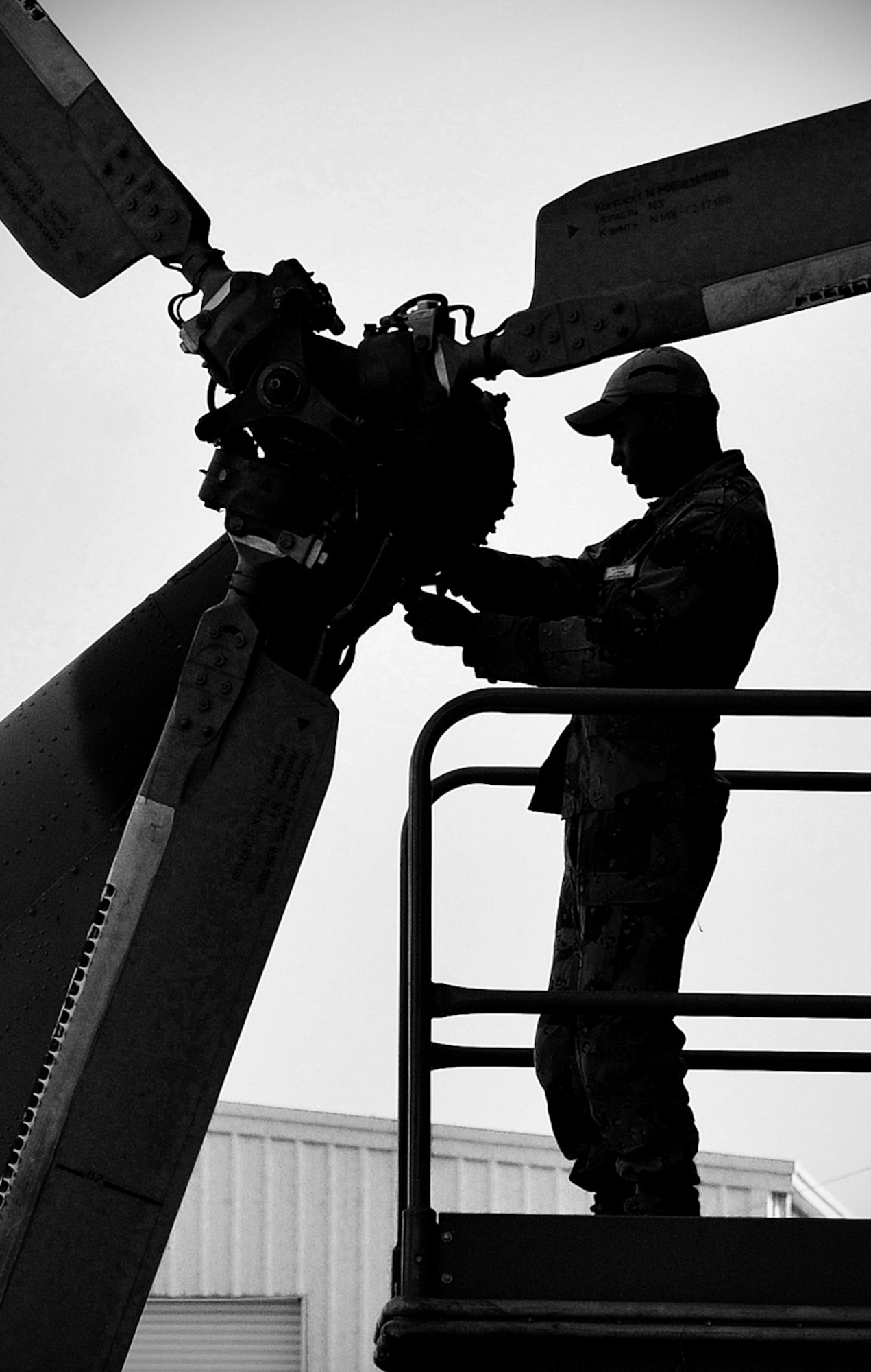 An Iraqi Army Aviation Command soldier adjusts the feathering hinge reservoir on the tail rotor of a Mi-17 helicopter Dec. 11, 2010, in Taji, Iraq. 721st Air Expeditionary Advisory Squadron air advisors work with the AAC at Taji to advise and assist them in building a safe, self-sustaining Iraqi rotary-wing force. (U.S. Air Force photo/Senior Airman Andrew Lee)