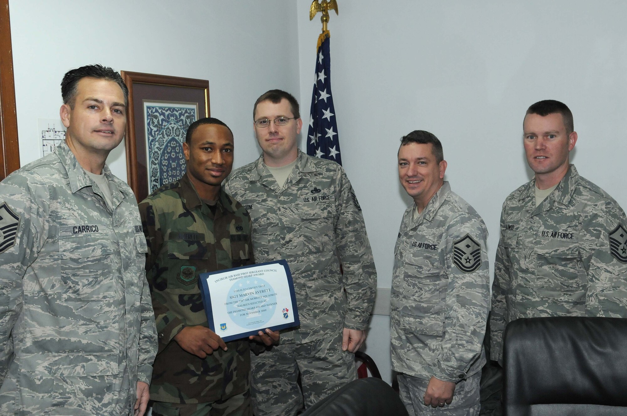 Staff Sgt. Marvin Averett, 728 Aircraft Maintenance Squadron, is presented
the 'Diamond Sharp' award by members of the  Incirlik First Sergeants
Council Dec. 16, 2010 at Incirlik Air Base, Turkey.  Sergeant Averett earned
the monthly award for November by distinguishing himself through outstanding
professionalism, performance and display of the Air Force core values.
(U.S. Air Force photo/Master Sgt. James Law)
