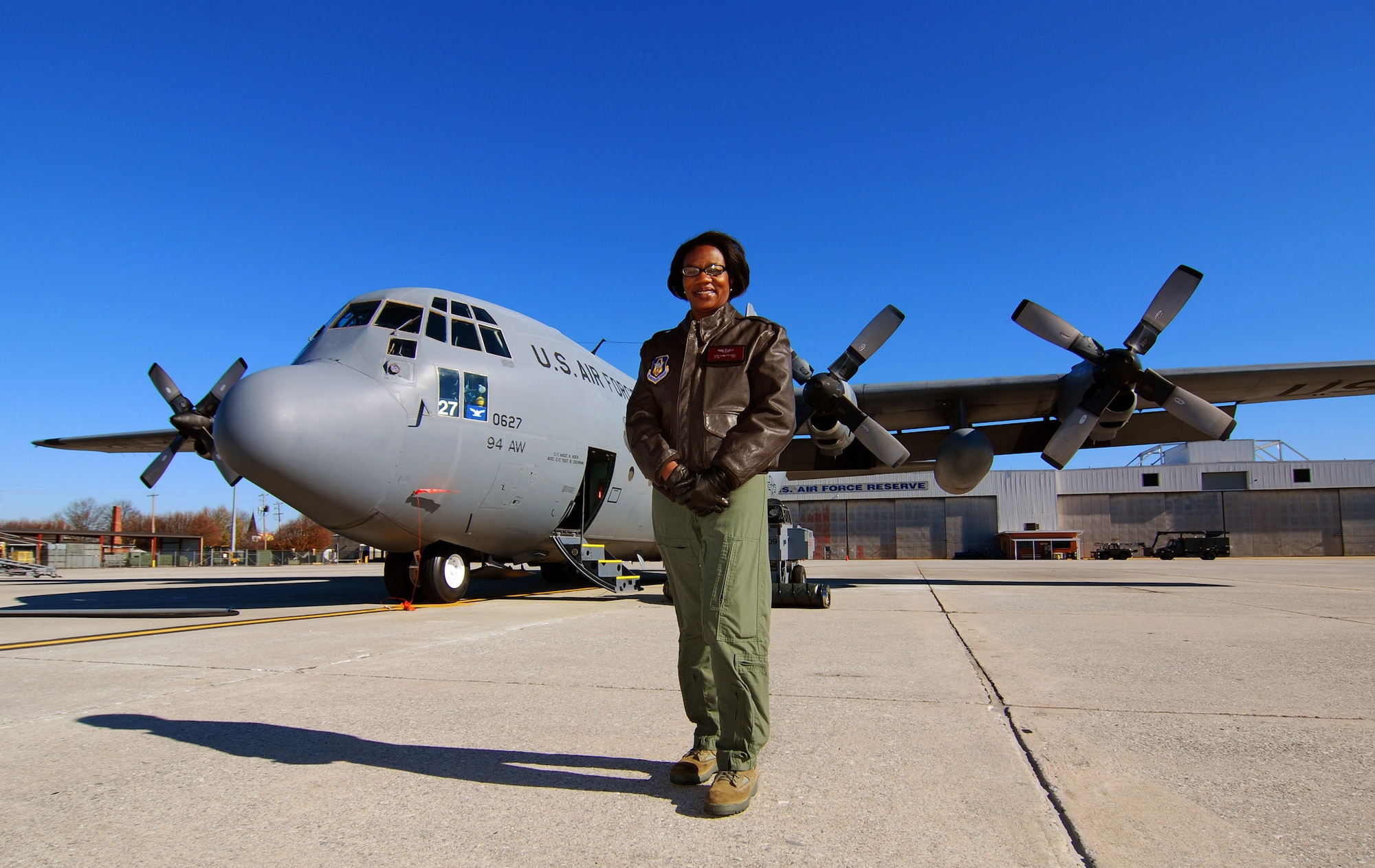 Lt. Col. Teresa C. Ayres, an Air Force Reserve flight nurse with the 514th Aeromedical Evacuation Squadron in front of a C-130H2 here, Dec. 14.  In civilian life Colonel Ayres is a nurse in the Vascular Institute at WellStar Kennestone Hospital in Marietta and travels to Joint Base McGuire-Dix-Lakehurst, N.J. for her reserve duty.  The Marietta Daily Journal ran an extensive Christmas day front-page story about her service to the community and over 21 years to the nation.  (U.S. Air Force photo/ Brad Fallin)