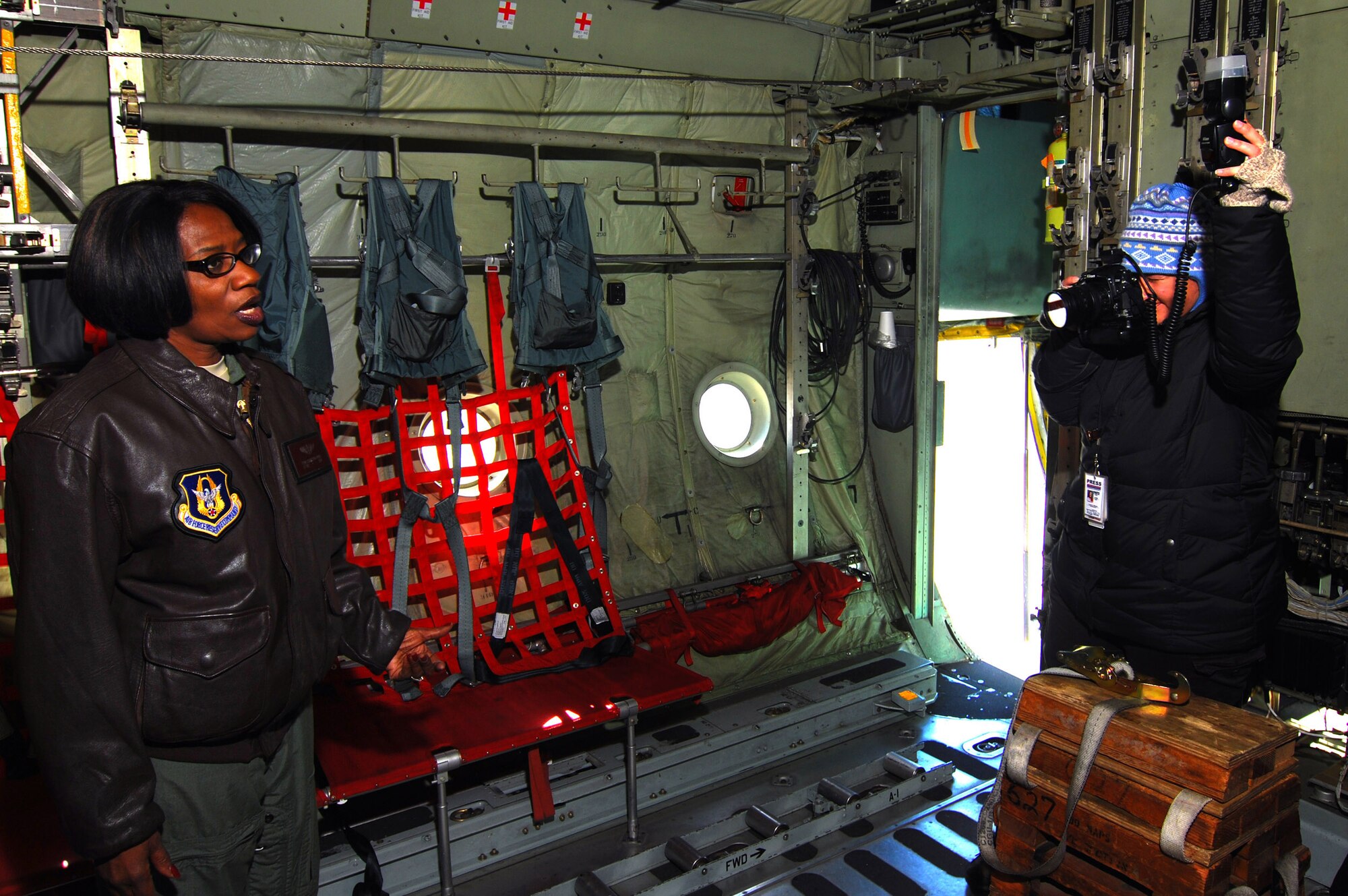 Lt. Col. Teresa C. Ayres, an Air Force Reserve flight nurse with the 514th Aeromedical Evacuation Squadron poses for a photo by Laura Moon in the cargo hold of a C-130H2 here, Dec. 14.  In civilian life Colonel Ayres is a nurse in the Vascular Institute at WellStar Kennestone Hospital in Marietta and travels to Joint Base McGuire-Dix-Lakehurst, N.J. for her reserve duty.  The Marietta Daily Journal ran an extensive Christmas day front-page story about her service to the community and over 21 years to the nation.  (U.S. Air Force photo/ Brad Fallin)