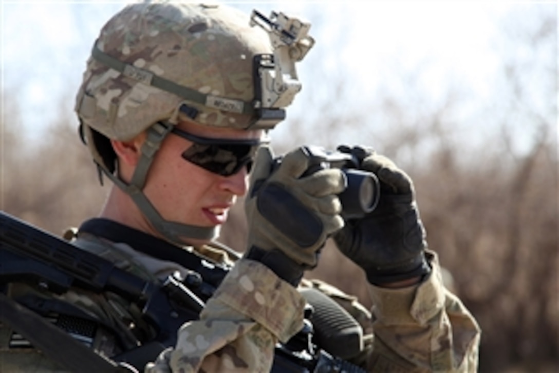 U.S. Army Pfc. Samuel Ford, with 1st Platoon, Bravo Company, 2nd Battalion, 4th Infantry Regiment, 4th Brigade Combat Team, 10th Mountain Division, uses a GPS camera to document a culvert during a patrol in the Sayed Abad district, Wardak province, Afghanistan, on Dec. 21, 2010.  