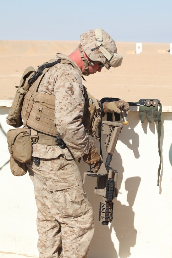 CAMP BUEHRING, Kuwait (Dec. 29, 2010) Lance Cpl. Daniel Lally III, a grenadier with 3rd Platoon, Company L, Battalion Landing Team 3/8, 26th Marine Expeditionary Unit (MEU), loads a high explosive round into an M32A1 grenade launcher during a live-fire exercise at Camp Buehring, Kuwait, Dec. 29. Elements of 26th MEU debarked the ships of Kearsarge Amphibious Ready Group to conduct sustainment training. (USMC photo by Sgt. Jesse J. Johnson/Released)