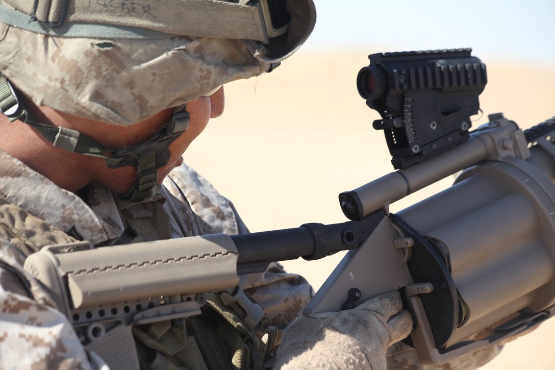 CAMP BUEHRING, Kuwait (Dec. 29, 2010) Cpl. Joshua Tucker, a crew chief with Amphibious Assault Vehicle Platoon, Company L, Battalion Landing Team 3/8, 26th Marine Expeditionary Unit, looks through the sights of an M32A1 grenade launcher during a live-fire exercise at Camp Buehring, Kuwait, Dec. 29. Elements of 26th MEU debarked the ships of Kearsarge Amphibious Ready Group to conduct sustainment training. (USMC photo by Sgt. Jesse J. Johnson/Released)