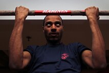 Chase Tillett, 20, from St. Paul, Minn., knocks out 20 pull-ups for basketball fans while taking the Marine Corps challenge at the Target Center where the Minnesota Timberwolves took on the Denver Nuggets Dec. 29. Tillett, who graduated from Tartan High School, ships off to boot camp Feb. 7. He is currently serving in the Delayed Entry Program as the Recruiting Substation Roseville guide. For more photos of the event, visit the Recruiting Station Twin Cities fan page at www.facebook.com/rstwincities.