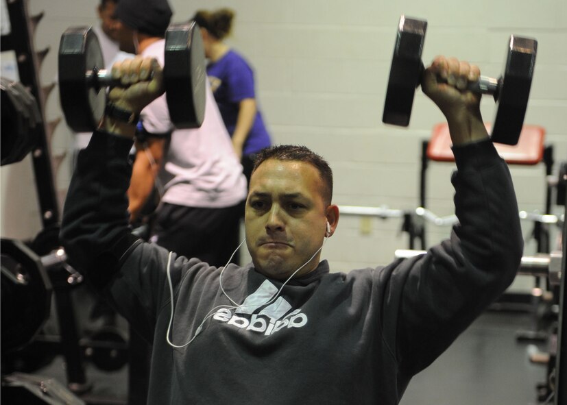 DYESS AIR FORCE BASE, Texas – Tech. Sgt. Michael Mantes, 317th Aircraft Maintenance Squadron, lifts weights Dec. 29 at the fitness center here. It’s important for Airmen to stay in shape so when the time comes they are fit for deployment. The gym is open Mon. thru Fri. 4 a.m. to midnight, weekend and holidays from 7 a.m. to 7 p.m. (U.S Air Force photo/ Airman 1st Class Shannon Hall) 